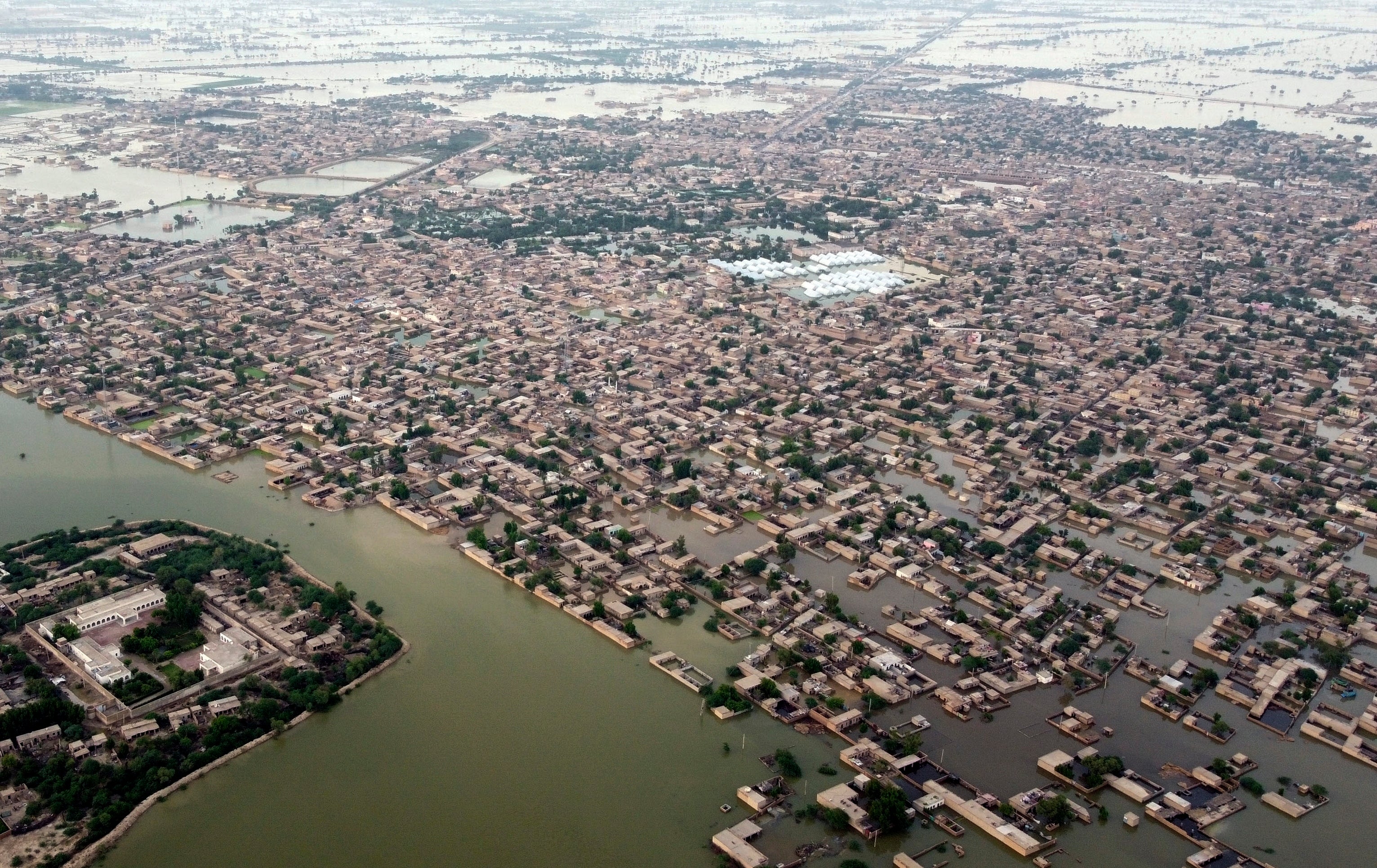 Homes surrounded by floodwaters in Jaffarabad, a district of Pakistan's southwestern Baluchistan after the 2022 flooding in Pakistan killed at least 1,700 people