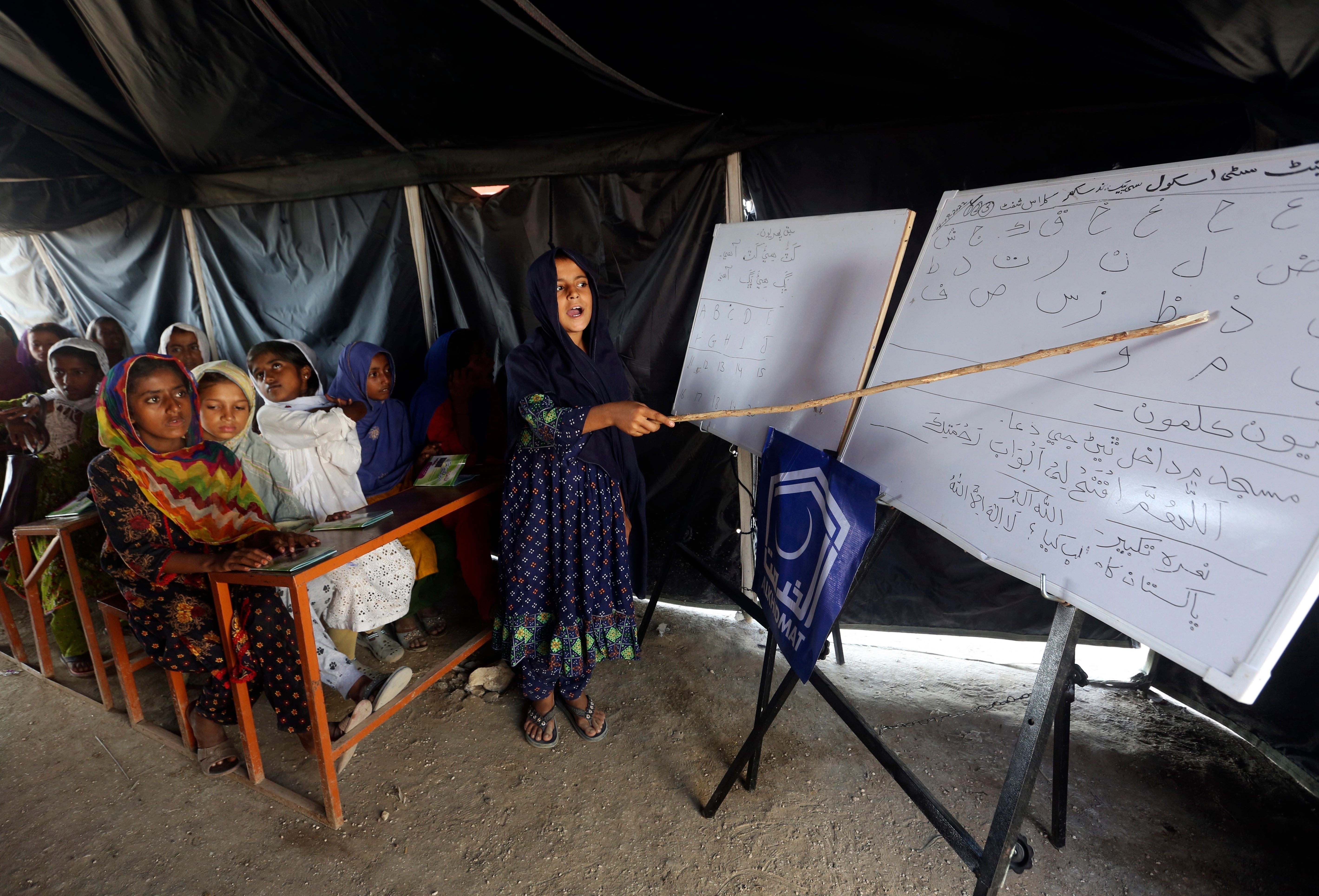 Flood affected children attend school organized by Islamic group Jamaat-e-Islami Pakistan, in Sukkur, Pakistan