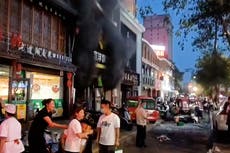 Plumes of smoke billow from Chinese barbecue restaurant as explosion kills 31