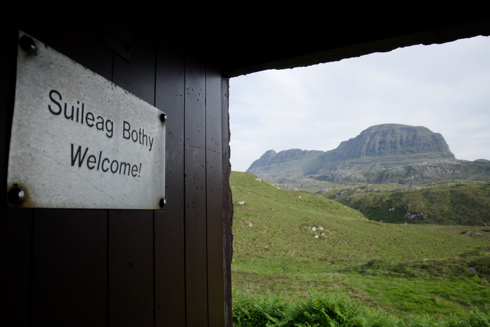 The view from the doorway of Suileag, facing out to Suilven, demonstrates the remote surroundings of many bothies