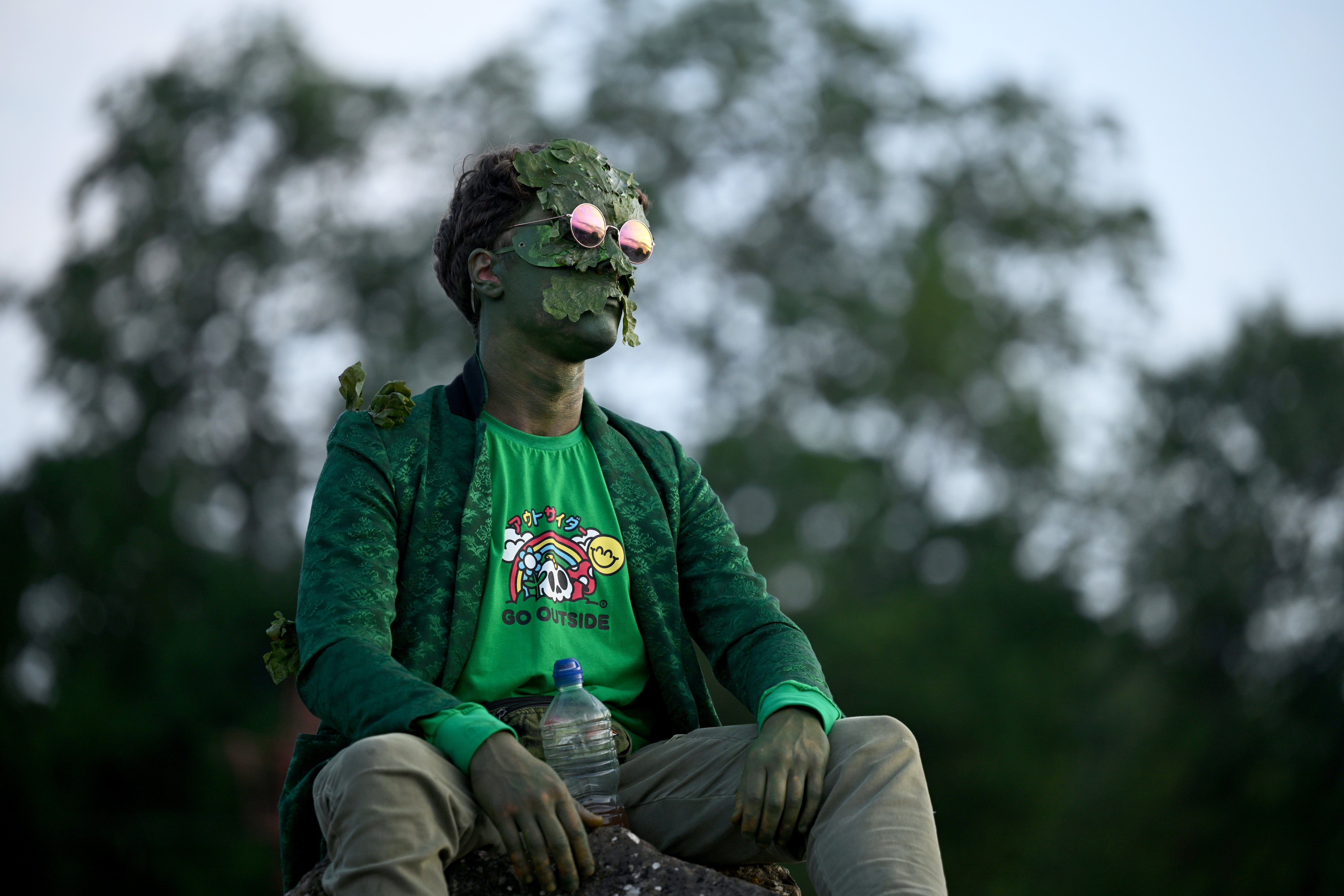 Festival goers gather at the stone circle for the sunset on day one of Glastonbury Festival 2023 on June 21, 2023