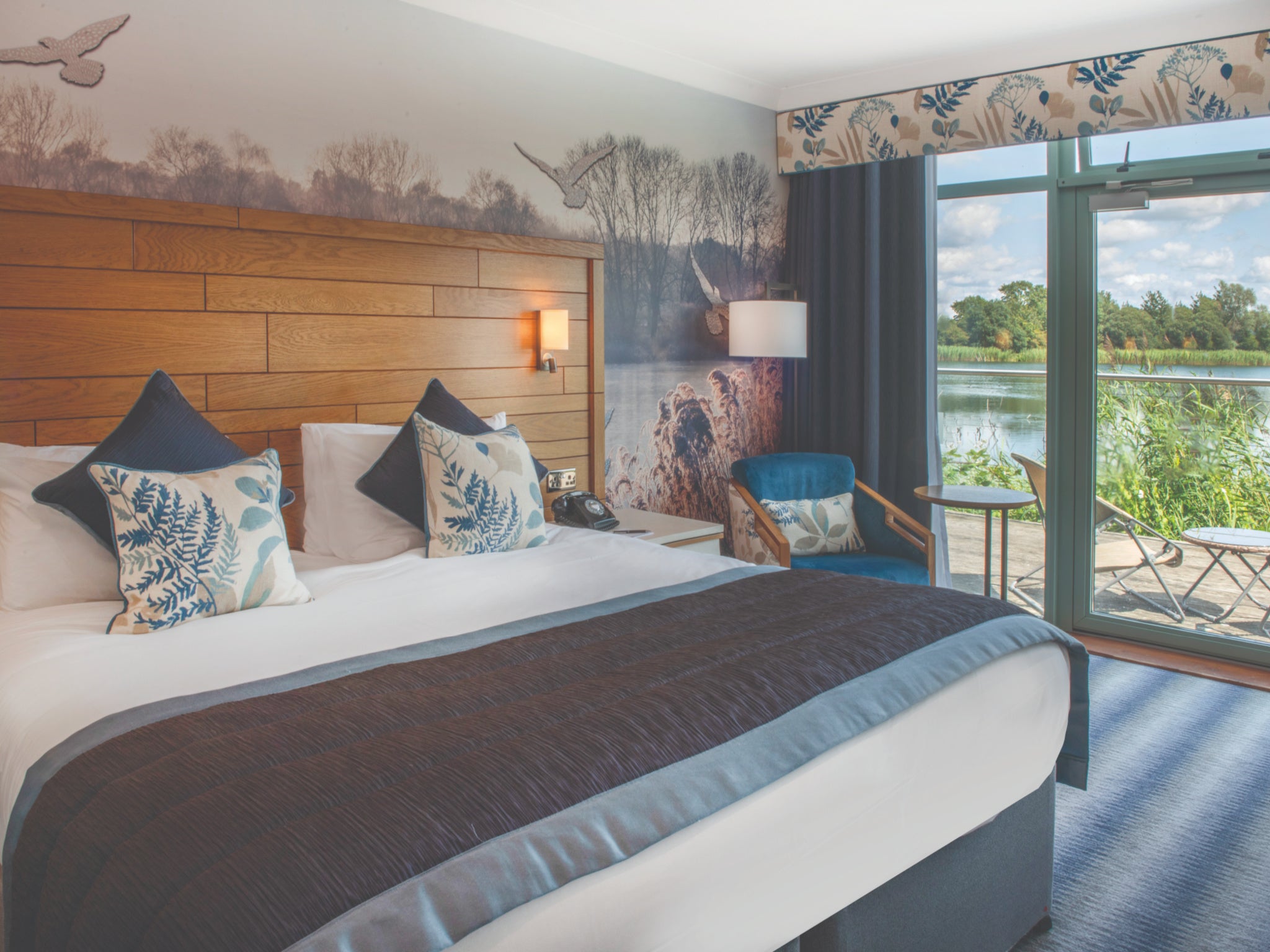 Enjoy calming views over the water from the comfort of your bed