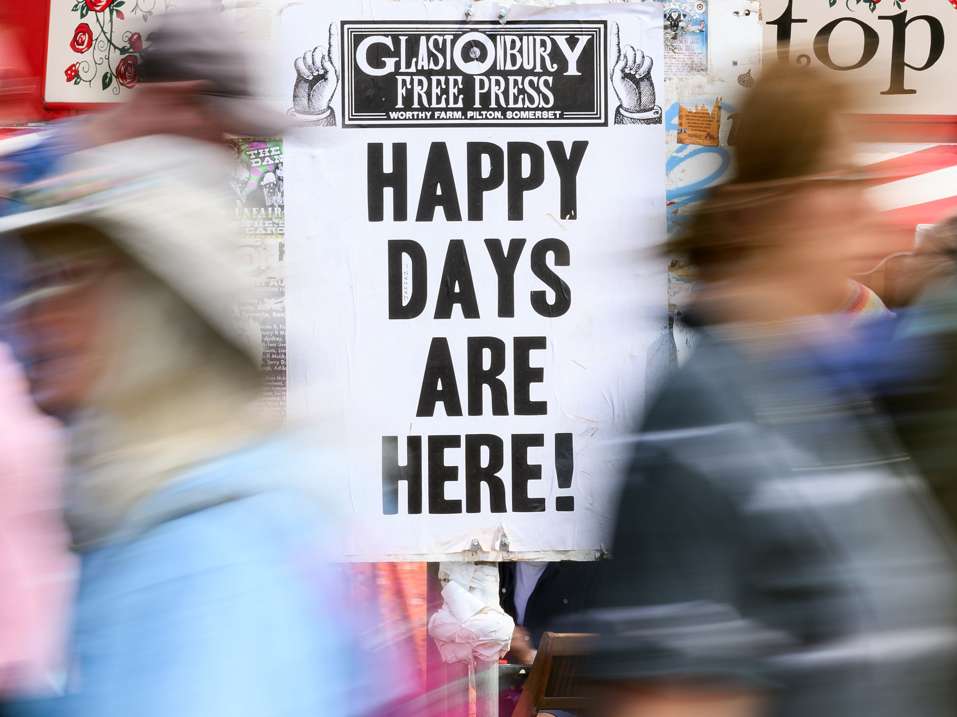 A sign reading Happy Days Are Here! at Glastonbury