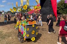 Glastonbury veteran showcases his quirky bike after arriving at festival