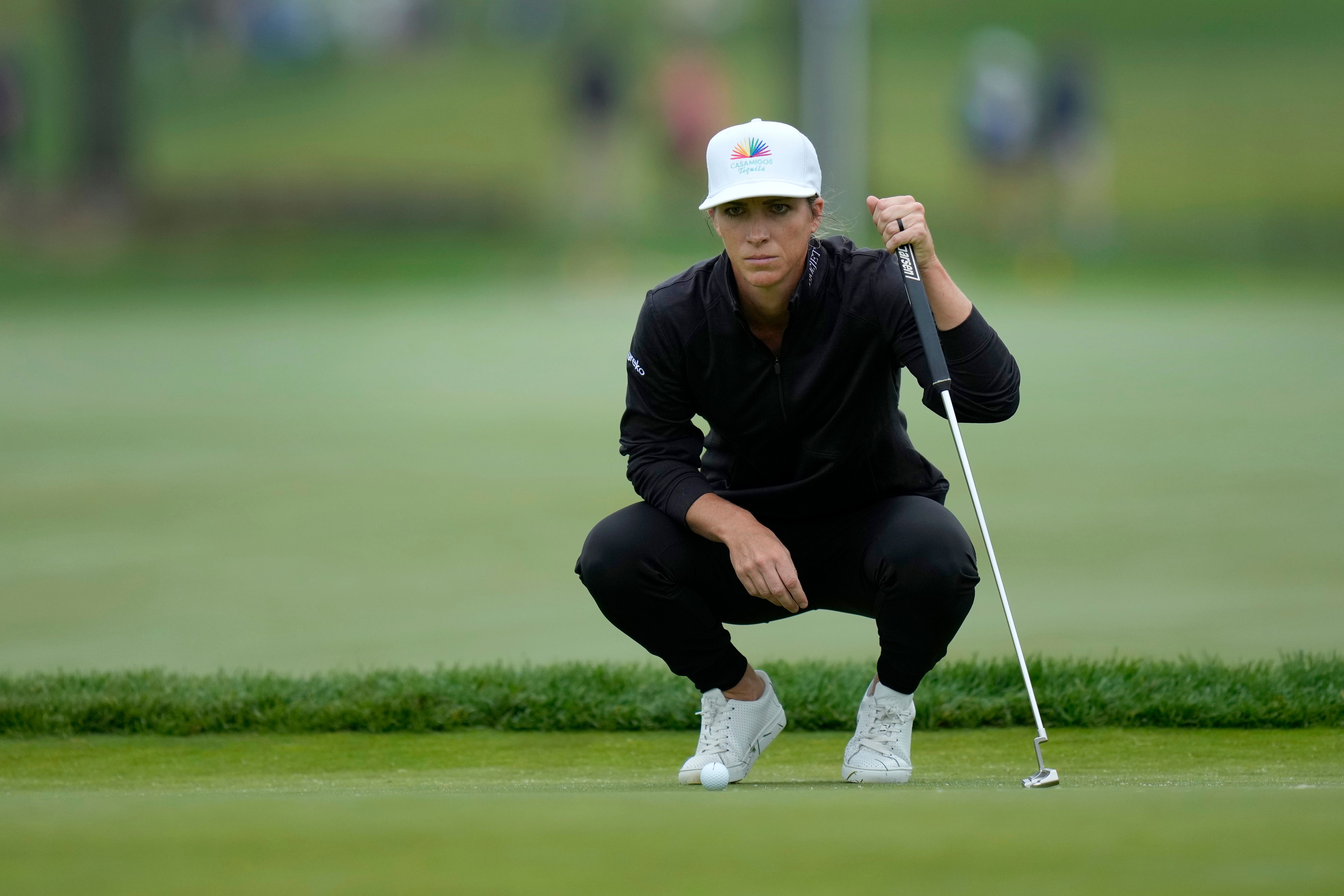 Mel Reid, of England, lines up a putt on the third hole (Seth Wenig/AP)