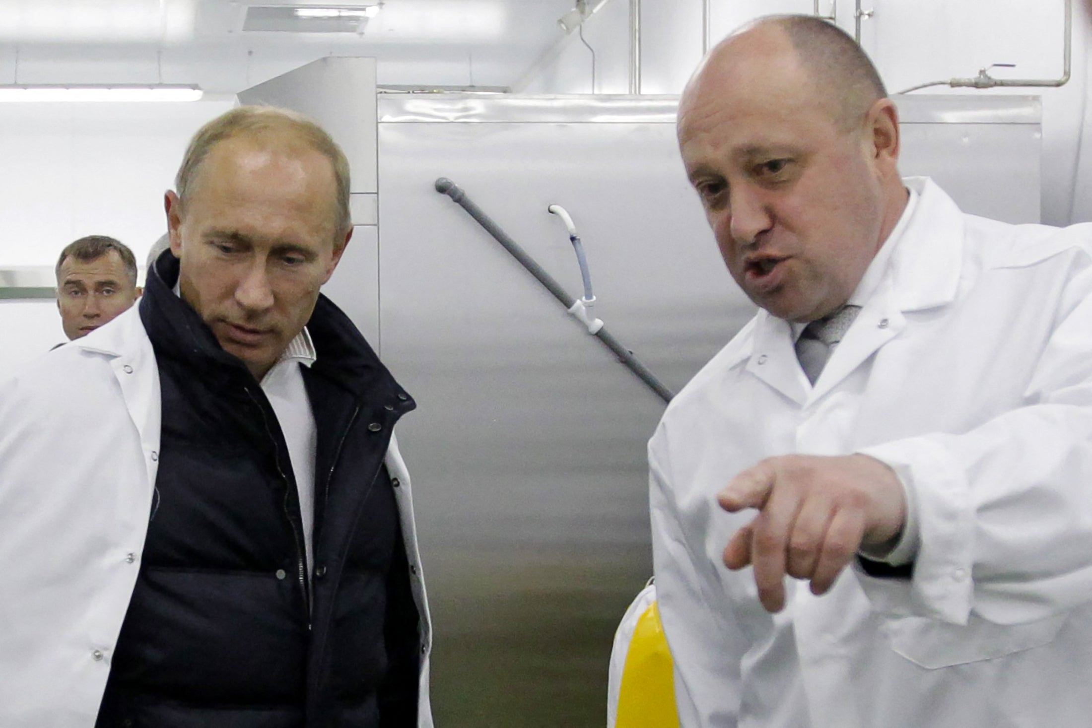 Prigozhin showing Vladimir Putin his school lunch factory outside St Petersburg in 2010