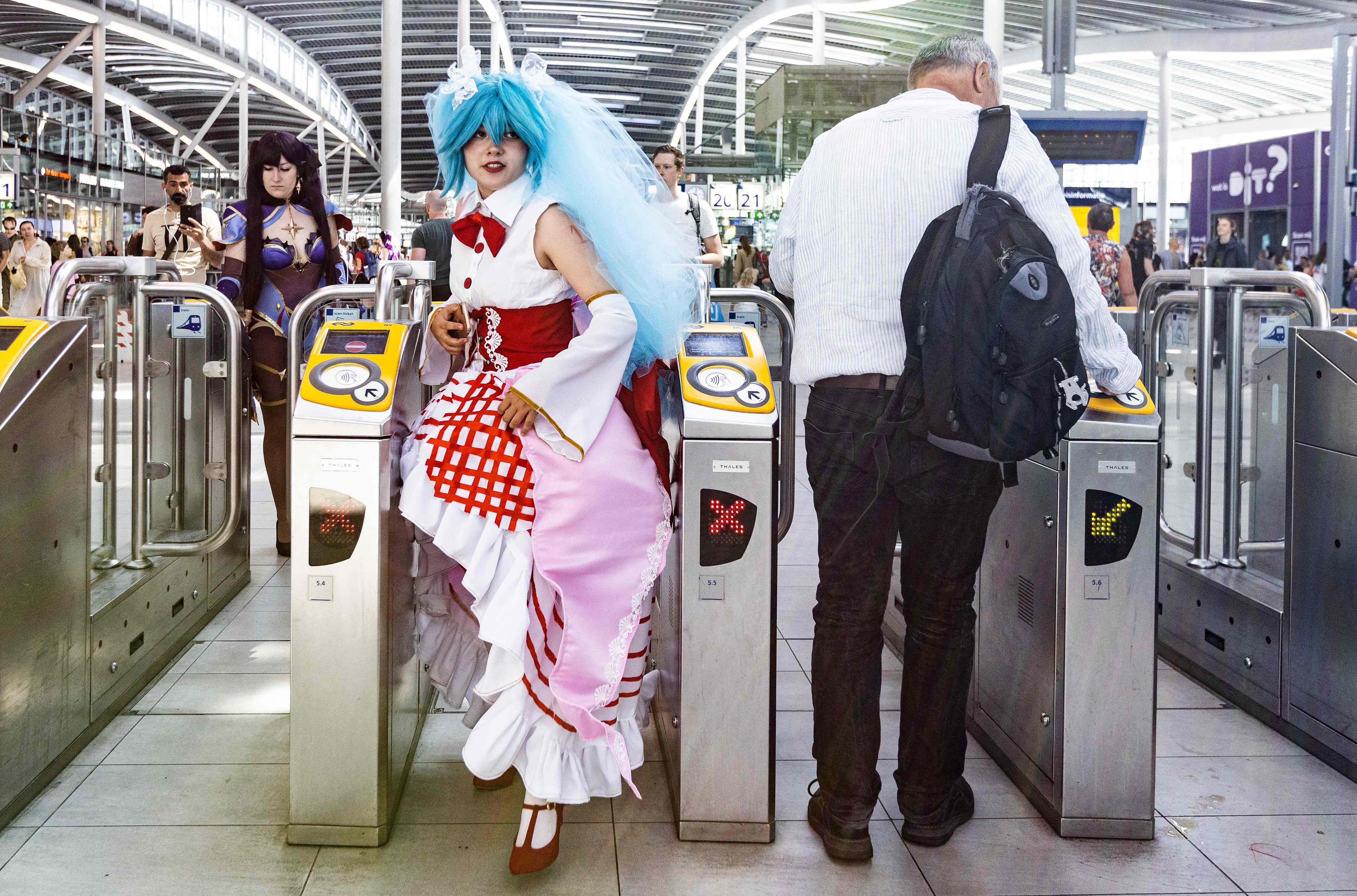 A woman dressed in a cosplay costume takes the subway during the Dutch Comic Con event in the Jaarbeurs in Utrecht