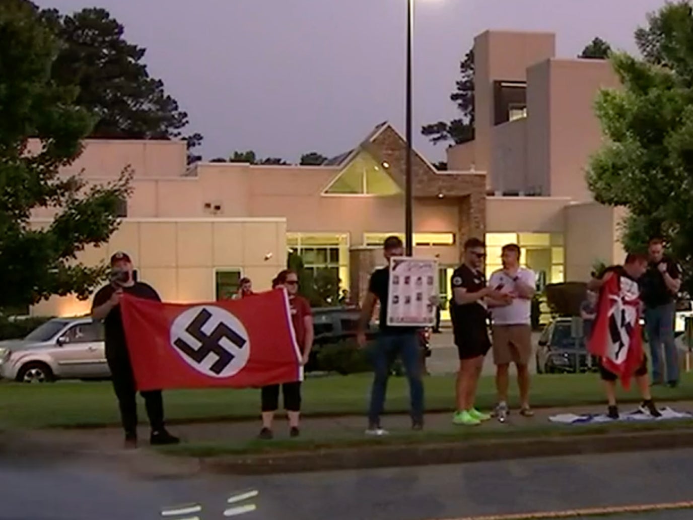 Shocking pictures and videos showed neo-Nazis with swastikas outside the Chabad of Cobb synagogue on Friday