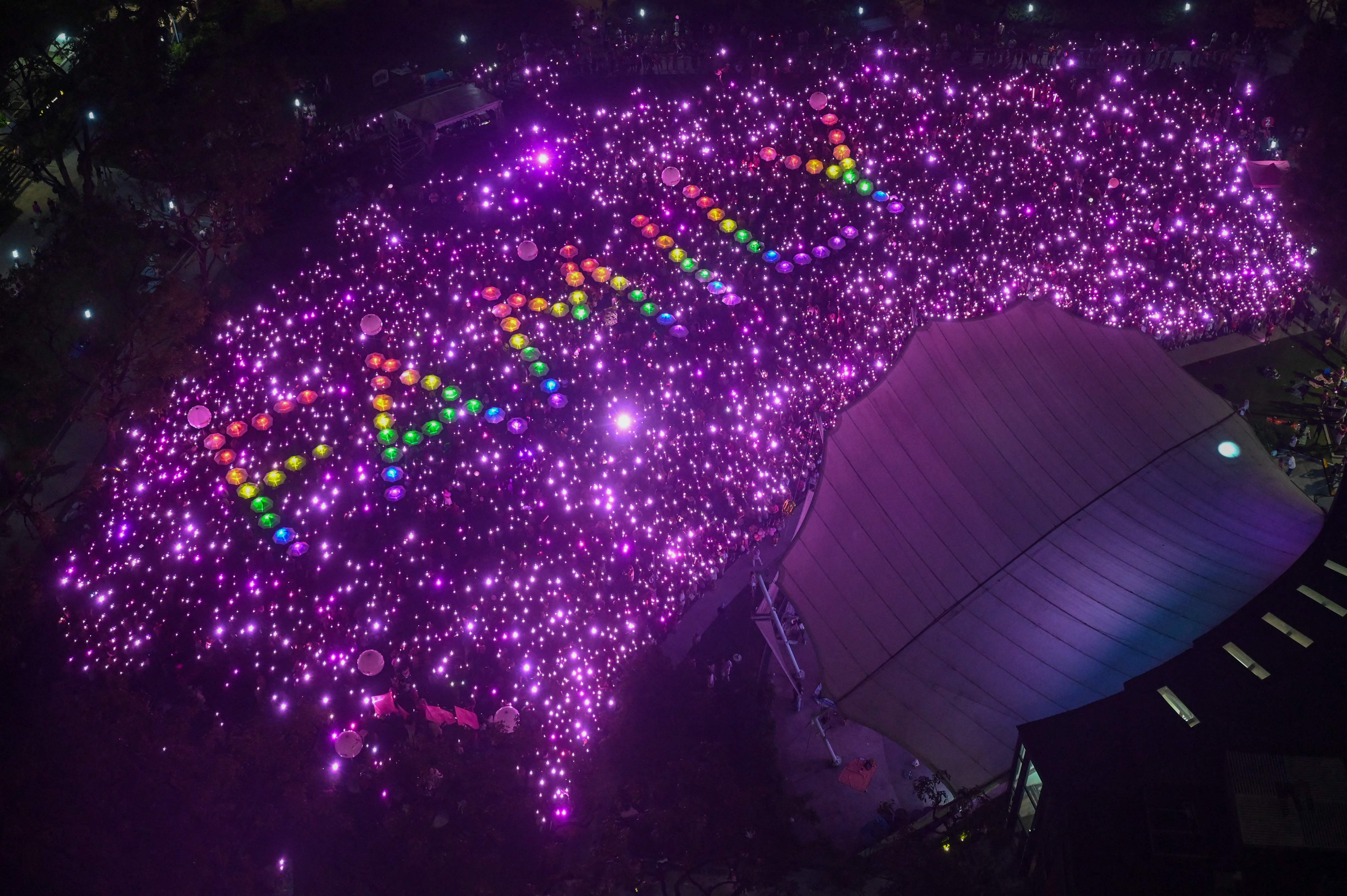 Supporters form the word 'Family' during the annual Pink Dot event in a public show of support for the LGBTQ community at Hong Lim Park in Singapore