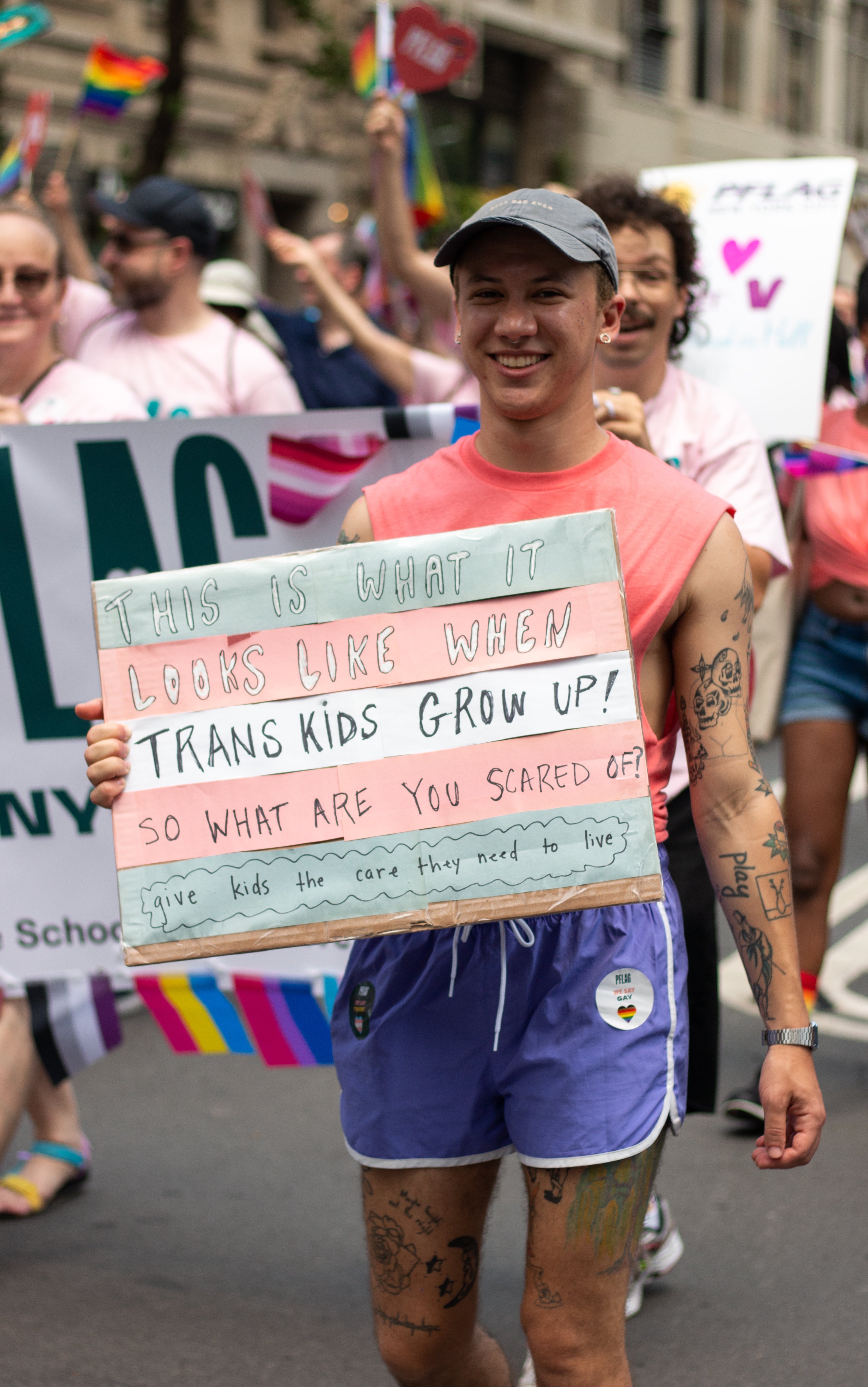 A New York City Pride marcher holds up a sign promoting transgender rights