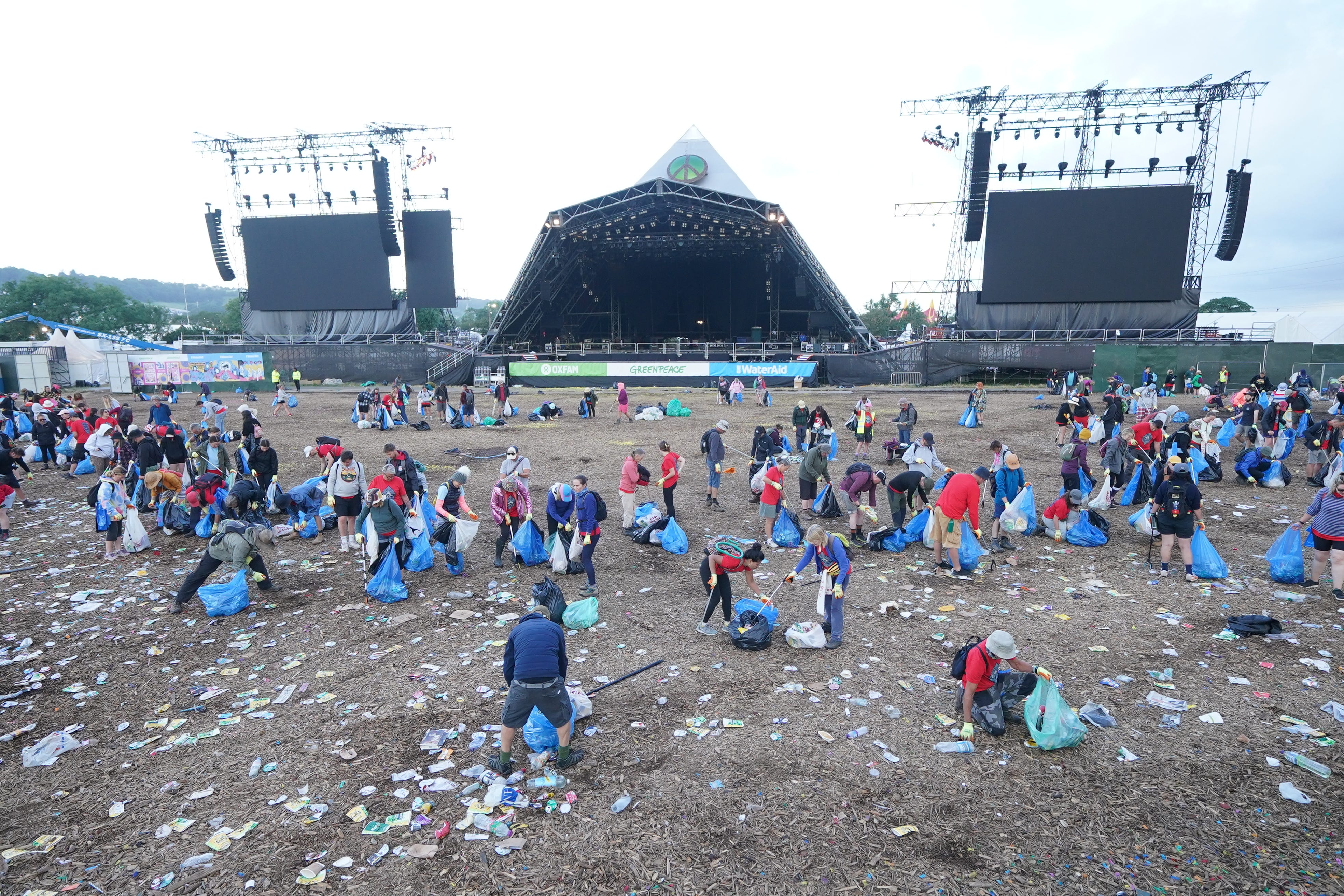 The clean up operation is taking place at the Glastonbury Festival (Yui Mok/PA)