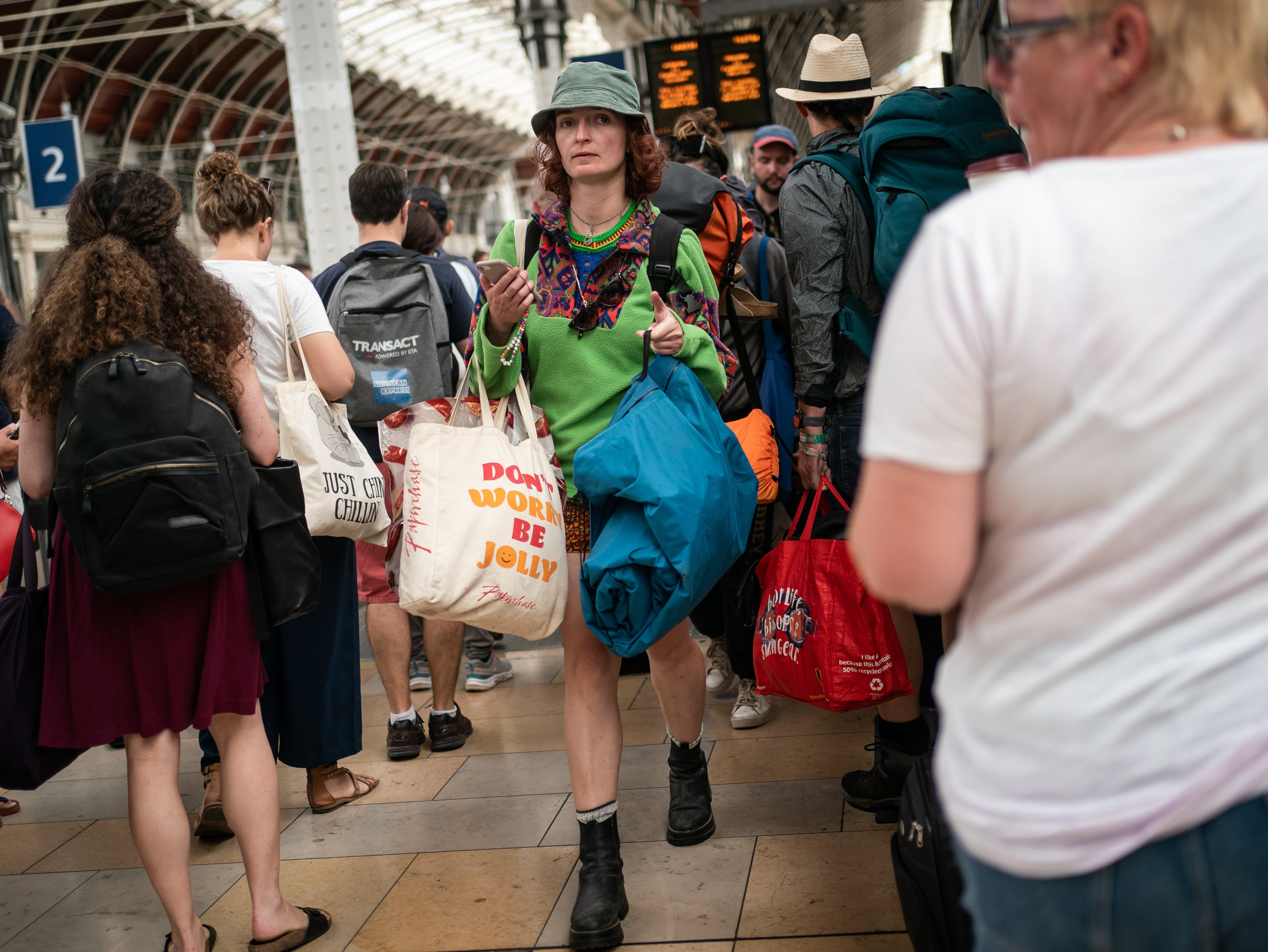 Glastonbury festival goers at Paddington