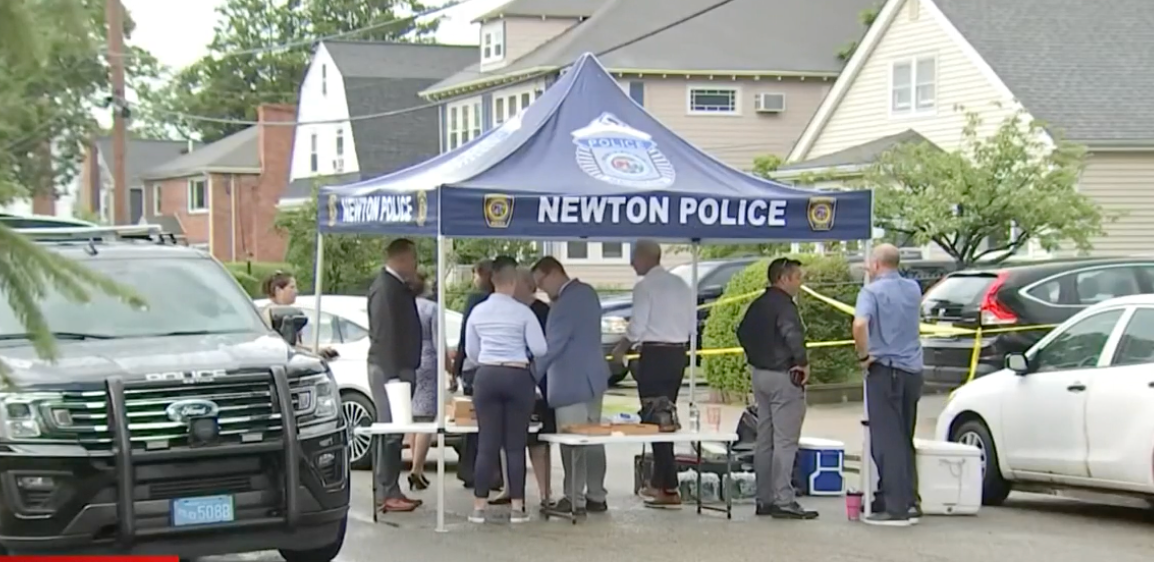 Police at the scene of a triple stabbing in Newton, Massachusetts, on Sunday