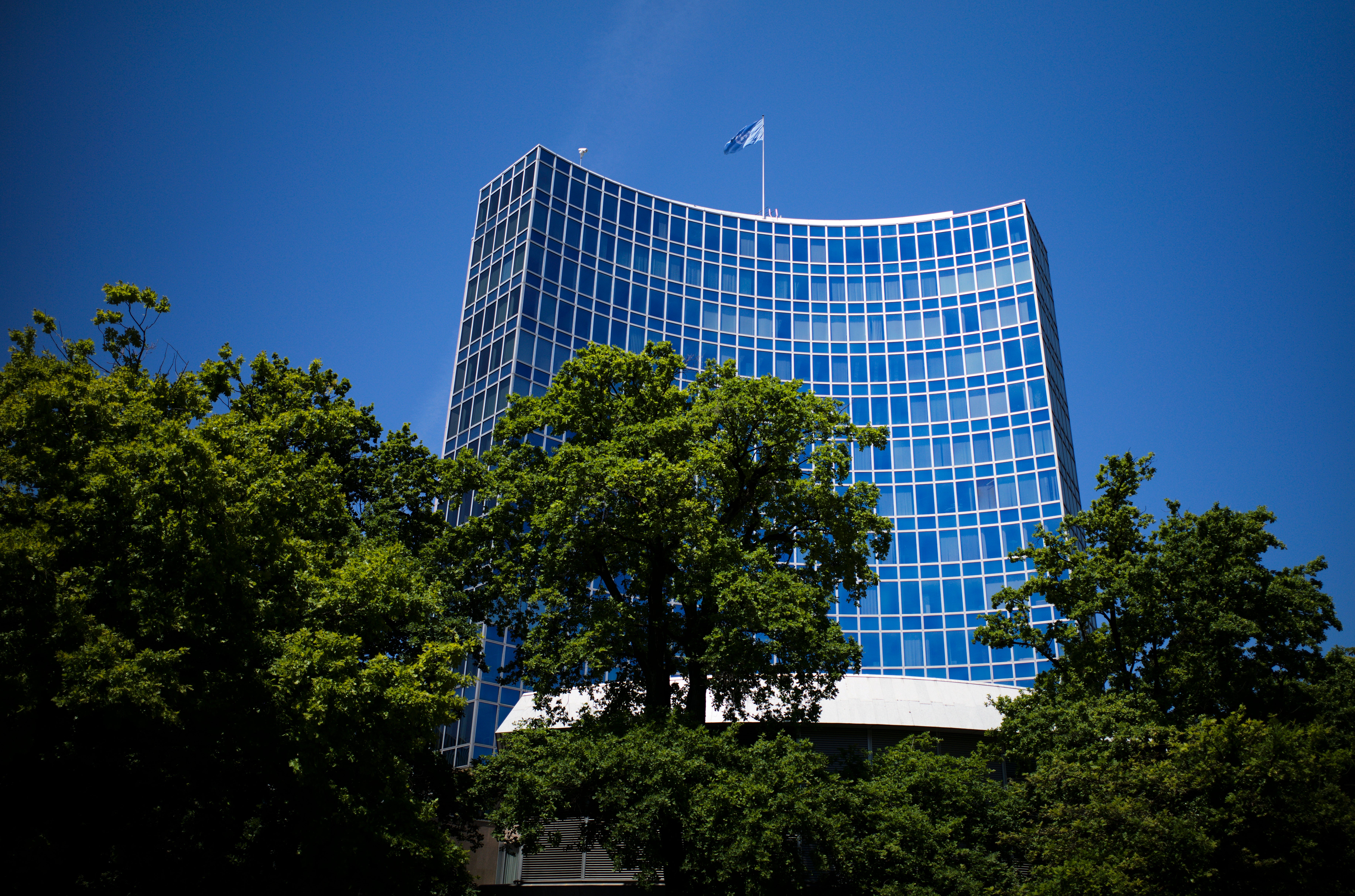 The United Nation flag waves in the wind on the top of a UN building in Geneva, Switzerland