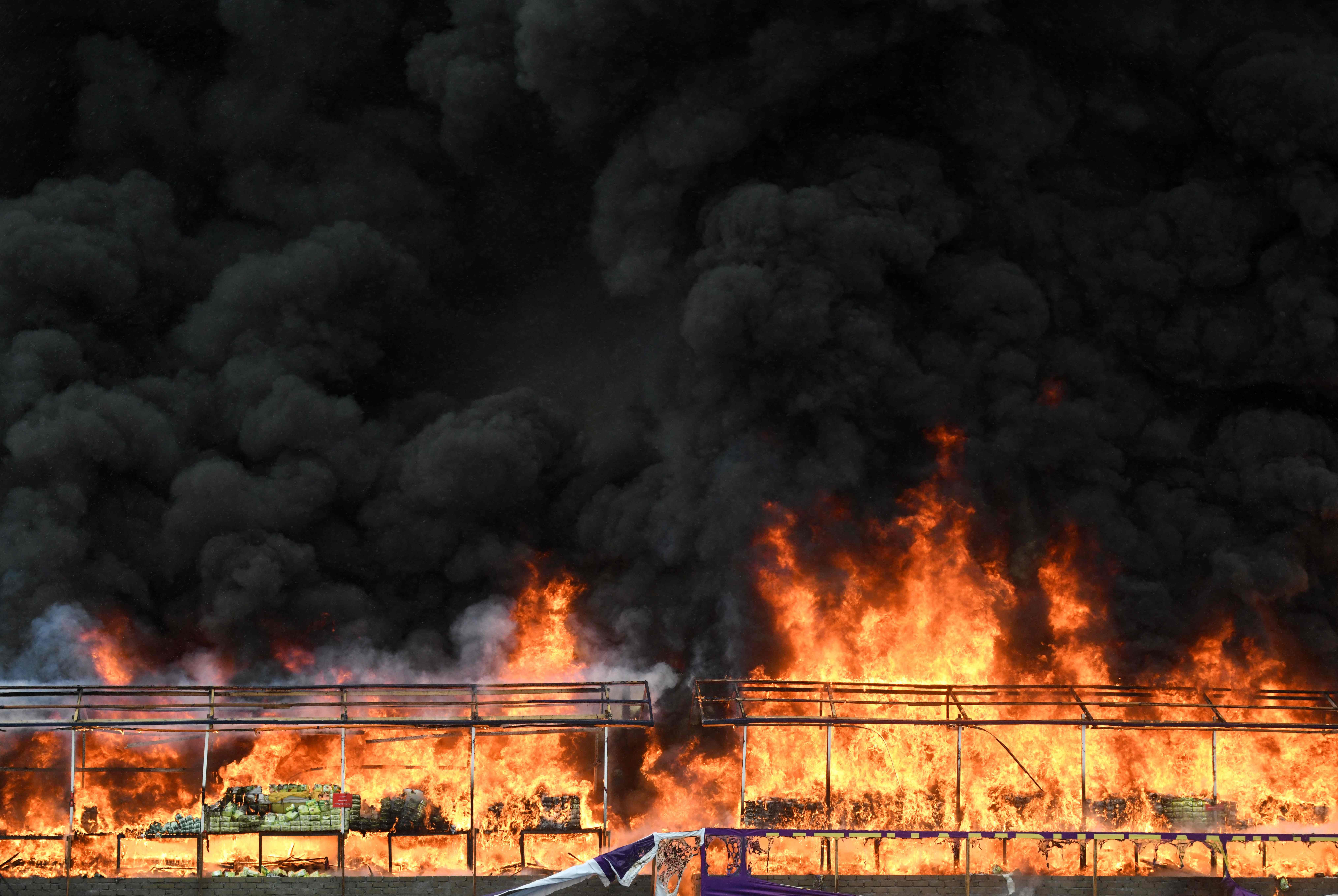 A burning pile of seized illegal drugs during a destruction ceremony to mark the “International Day against Drug Abuse and Illicit Trafficking” in Yangon