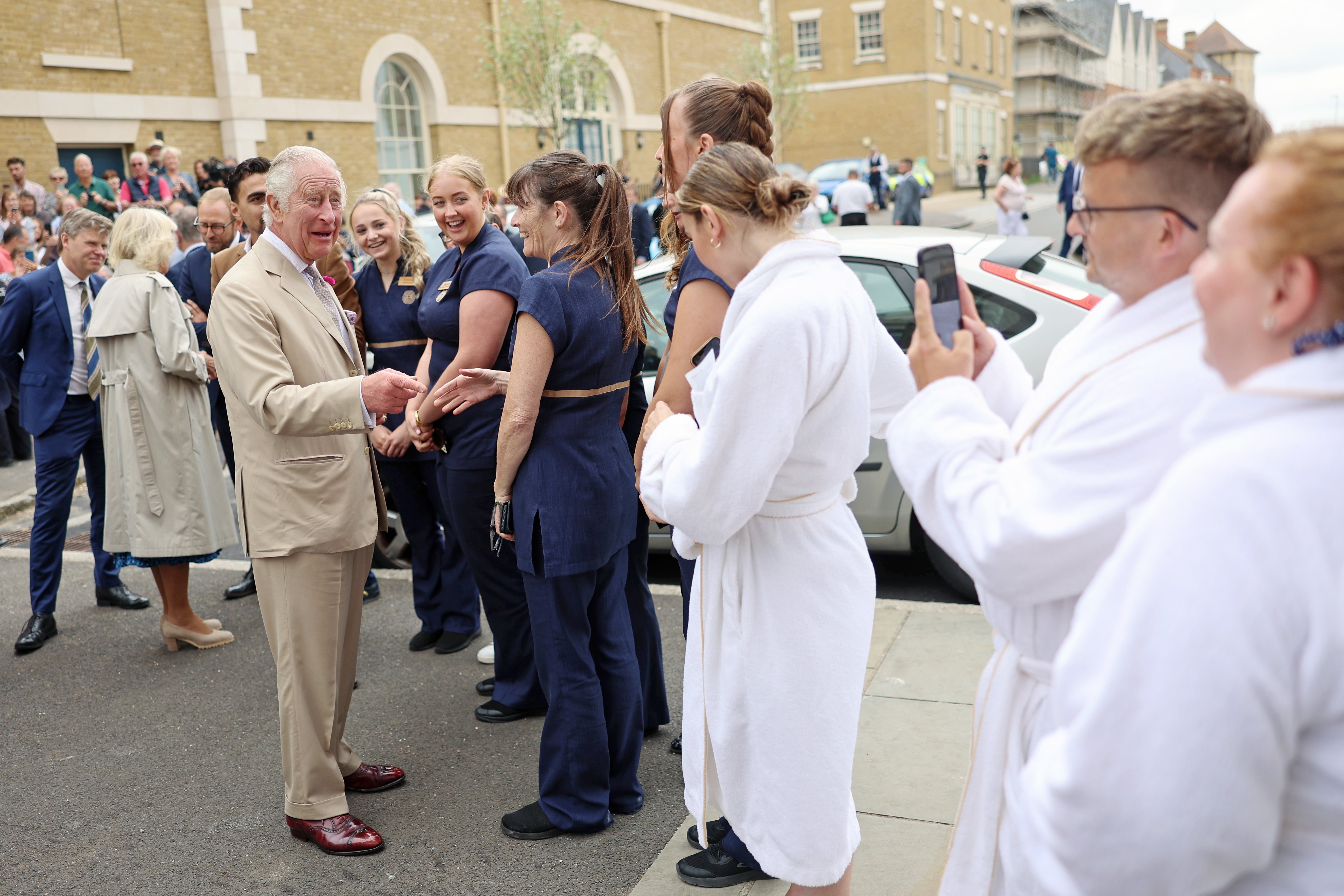 King Charles III meets employees and clients of the spa during his visit at Poundbury on June 27, 2023 in Dorchester, Dorset