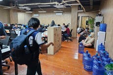 Philippine police raid alleged cybercrime buildings and rescue 2,700 workers from 18 countries