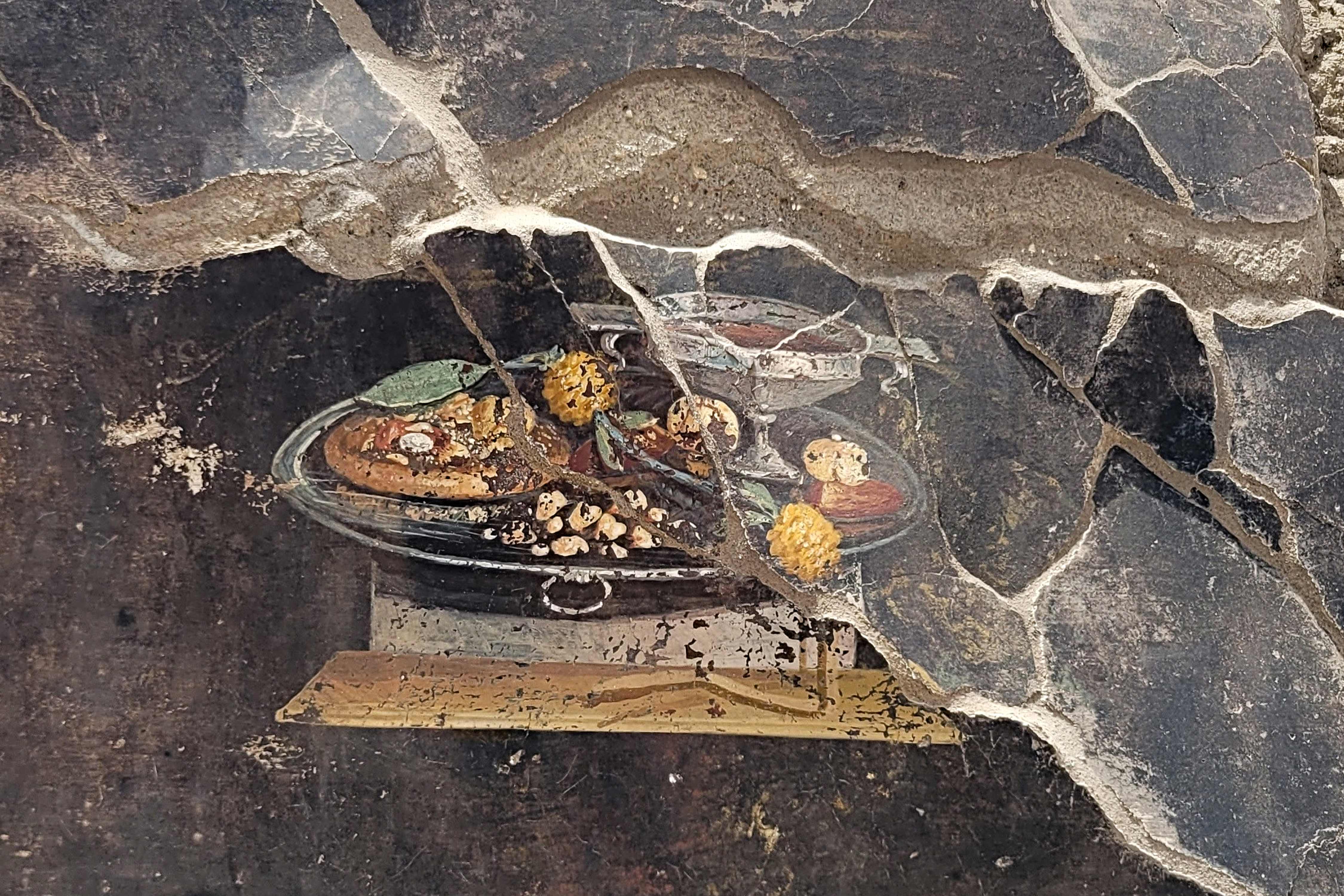 The still life fresco is 2,000 years old and depicts an ancestor of the pizza