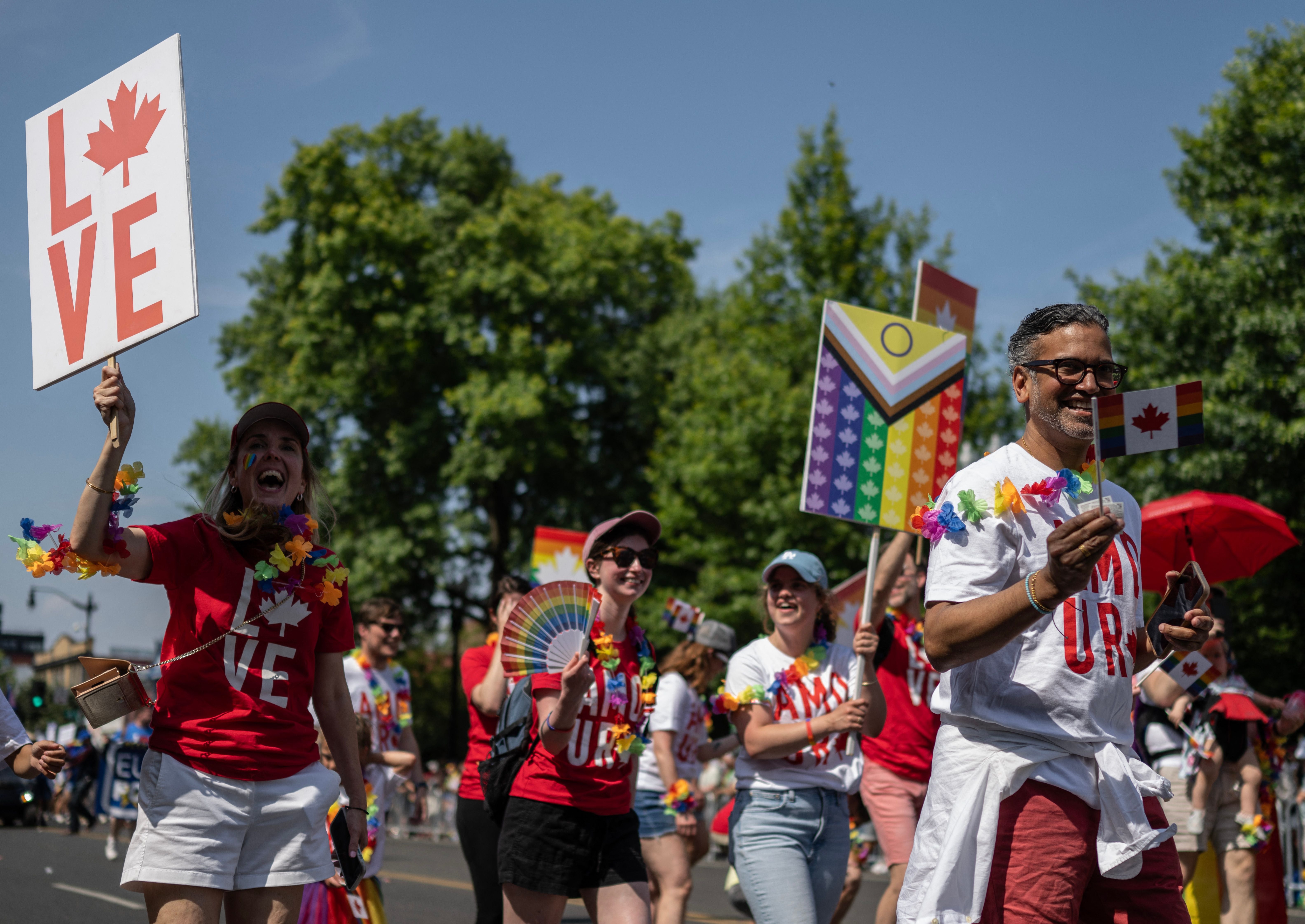 Members from the Canadian embassy and community march down the road during the Capital Pride Festival in Washington, DC, on June 10, 2023