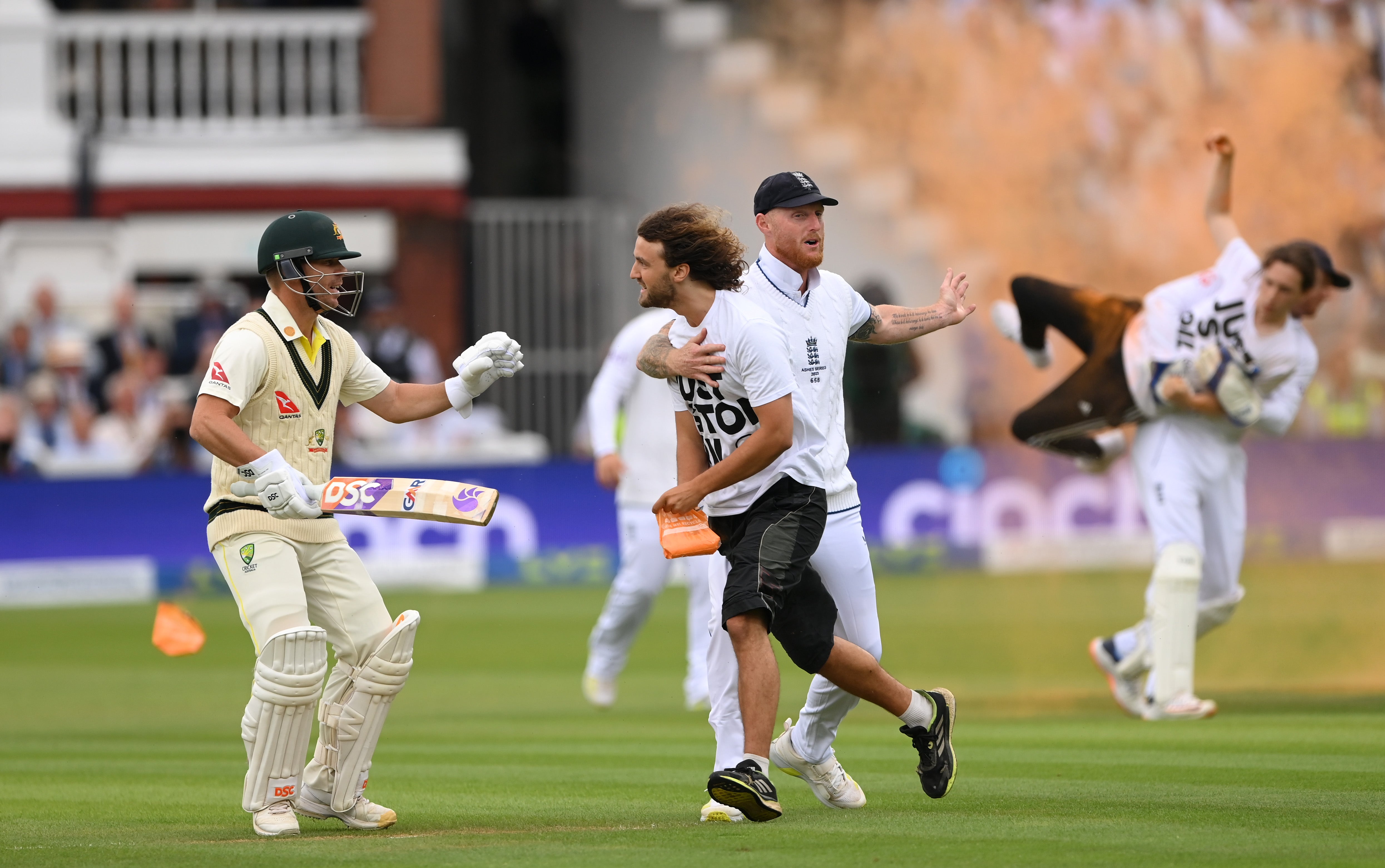 England captain Ben Stokes intervenes as Bairstow drags off the other protester