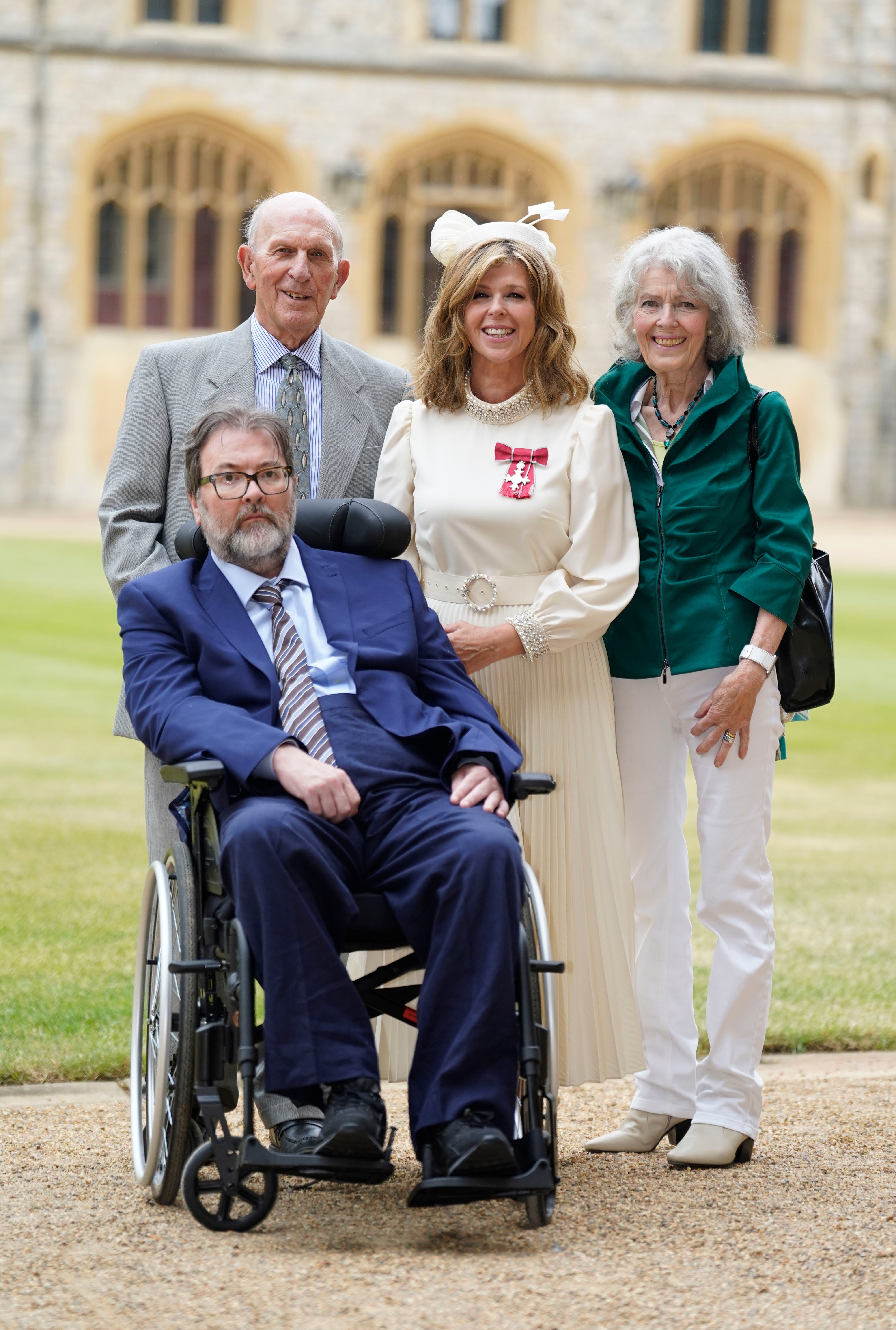 Kate Garraway, with her husband Derek Draper and her parents Gordon and Marilyn Garraway, after being made a Member of the Order of the British Empire