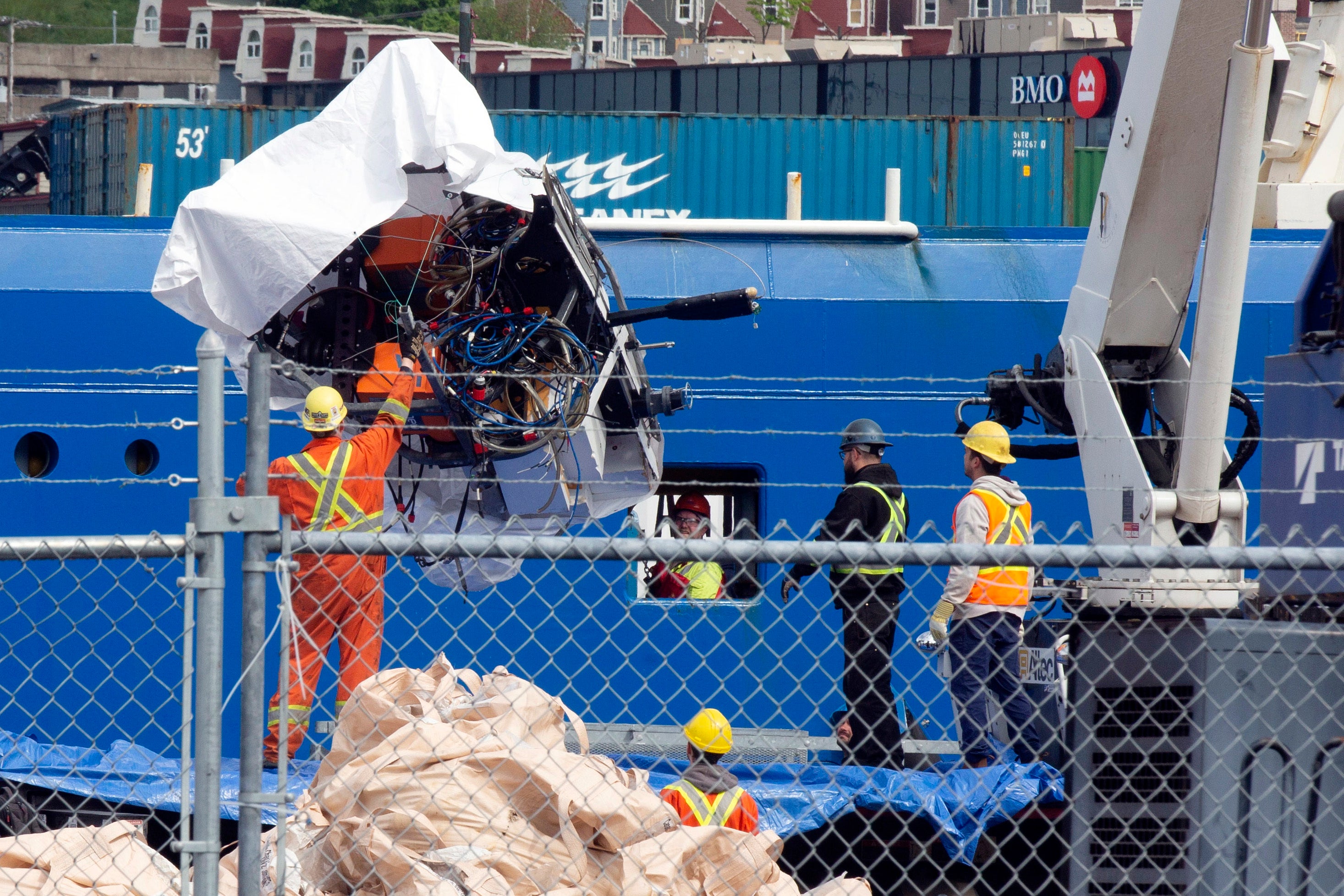 Debris from the Titan submersible, recovered from the ocean floor near the wreck of the Titanic, is unloaded from the ship Horizon Arctic at the Canadian Coast Guard pier in St. John's, Newfoundland, Wednesday, June 28, 2023.