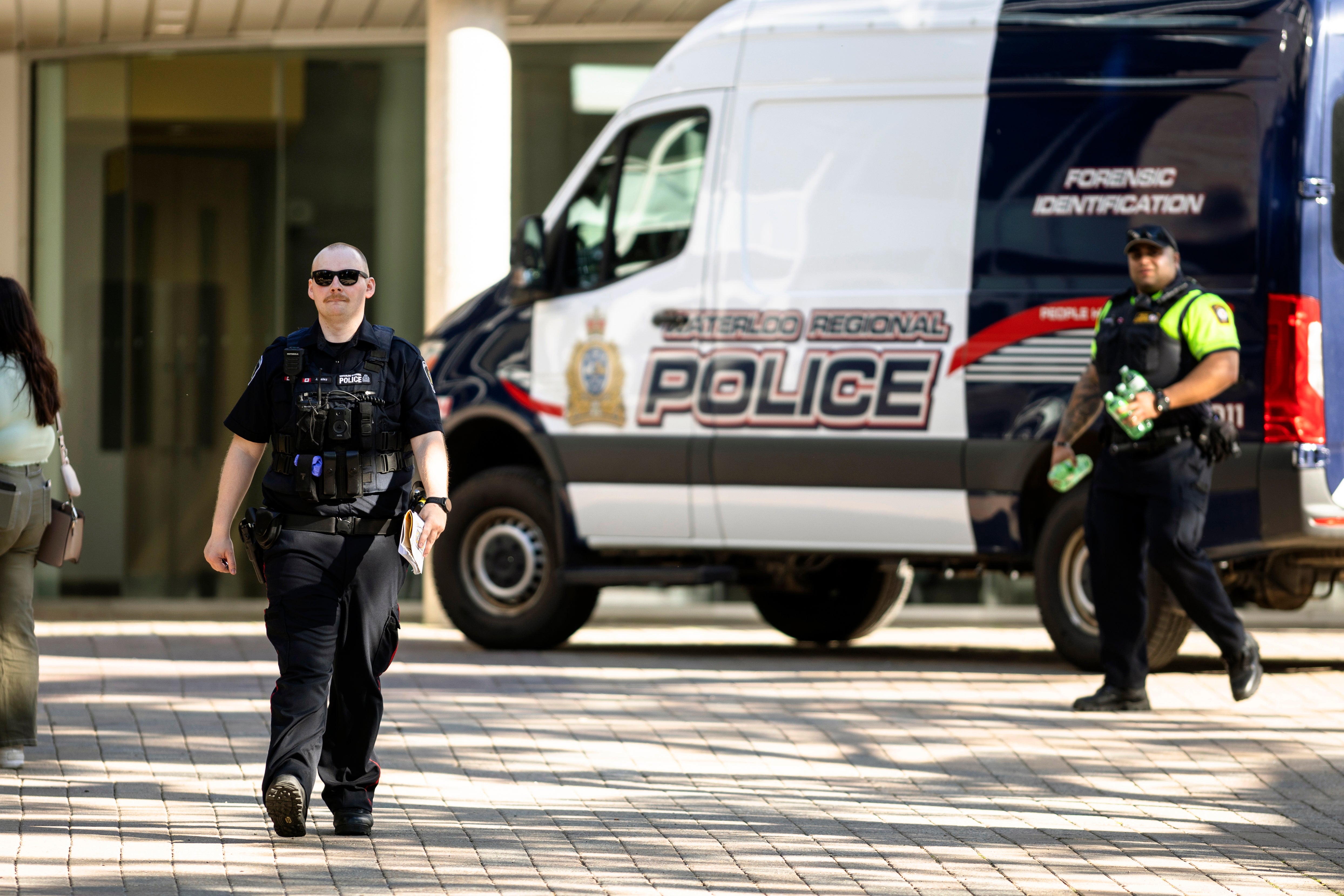 Members of the Waterloo Regional Police investigate a stabbing at the University of Waterloo, in Waterloo, Ontario, Wednesday, June 28, 2023.