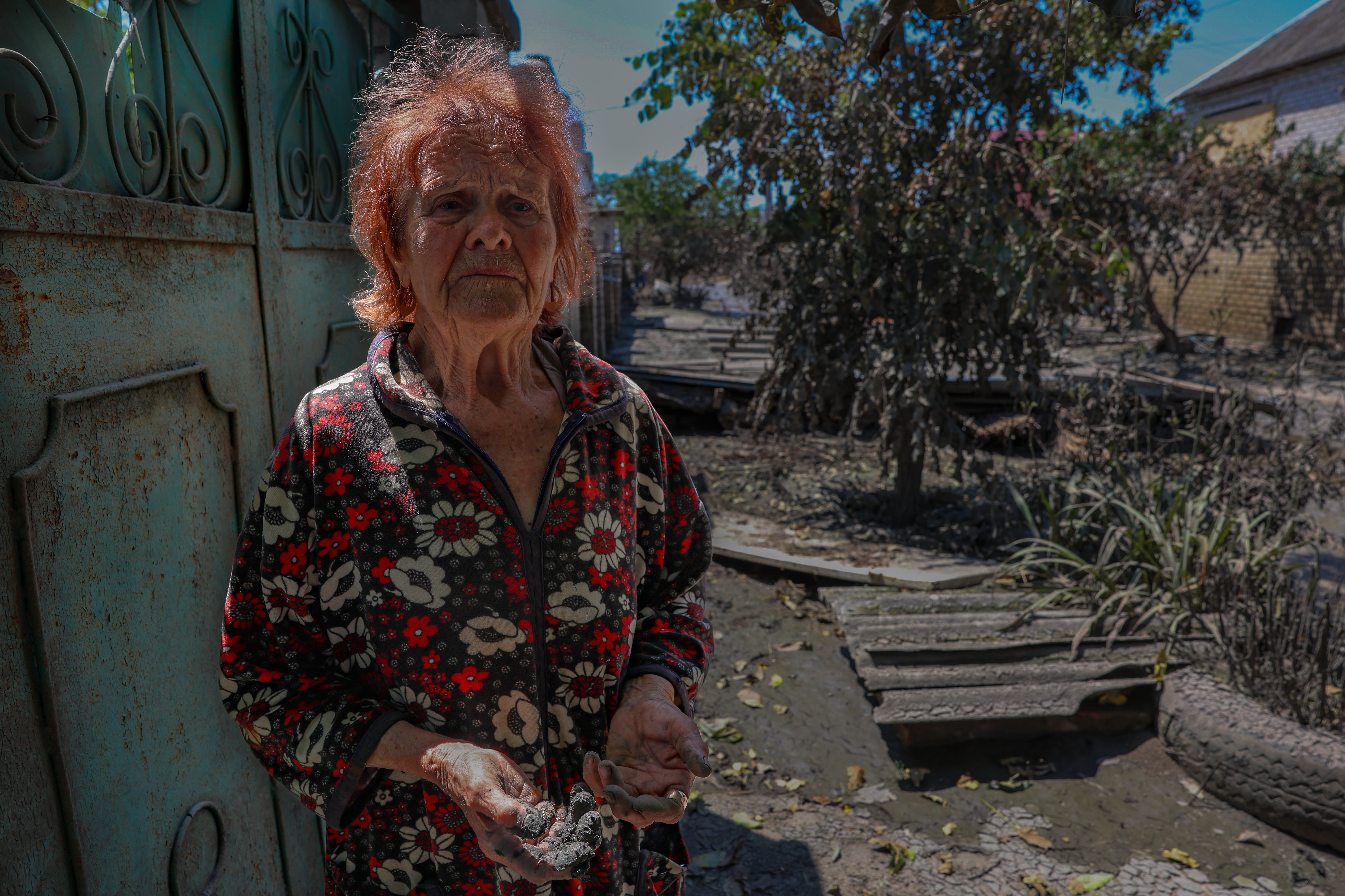 Antonia, 84, in a nightie that is the only possession she has left in the world after the waters of the Kakhovka dam destroyed her home