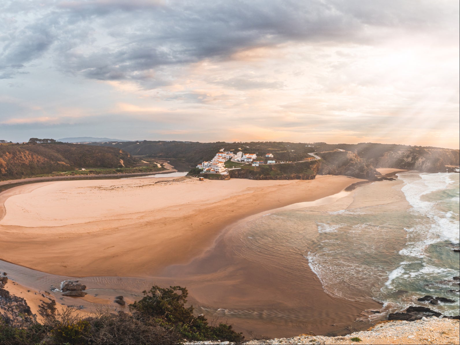 This beach straddles the border of the Algarve and Alentejo regions