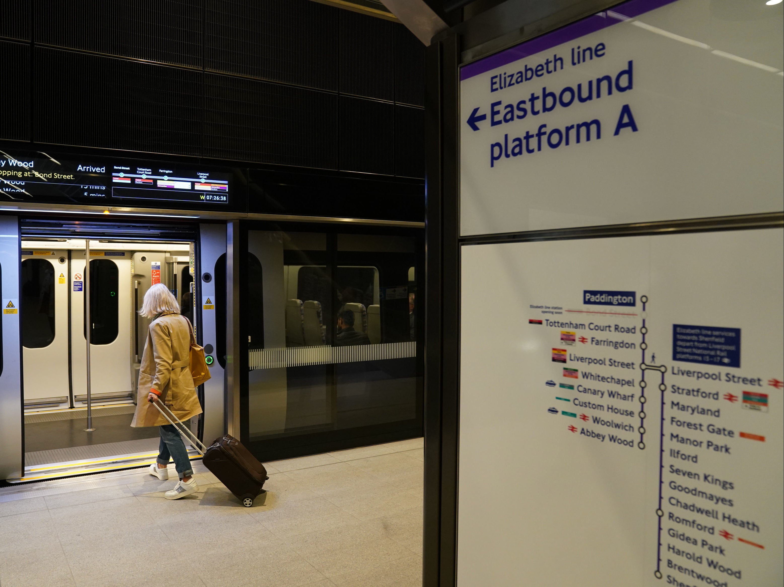 A wary customer boards the Elizabeth Line