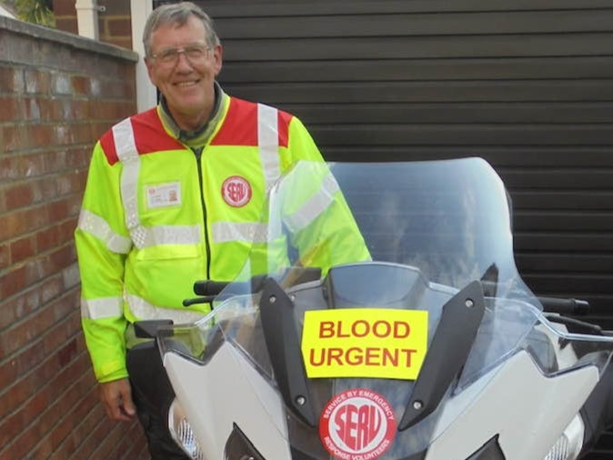 Mr Lougee with his emergency response motorbike