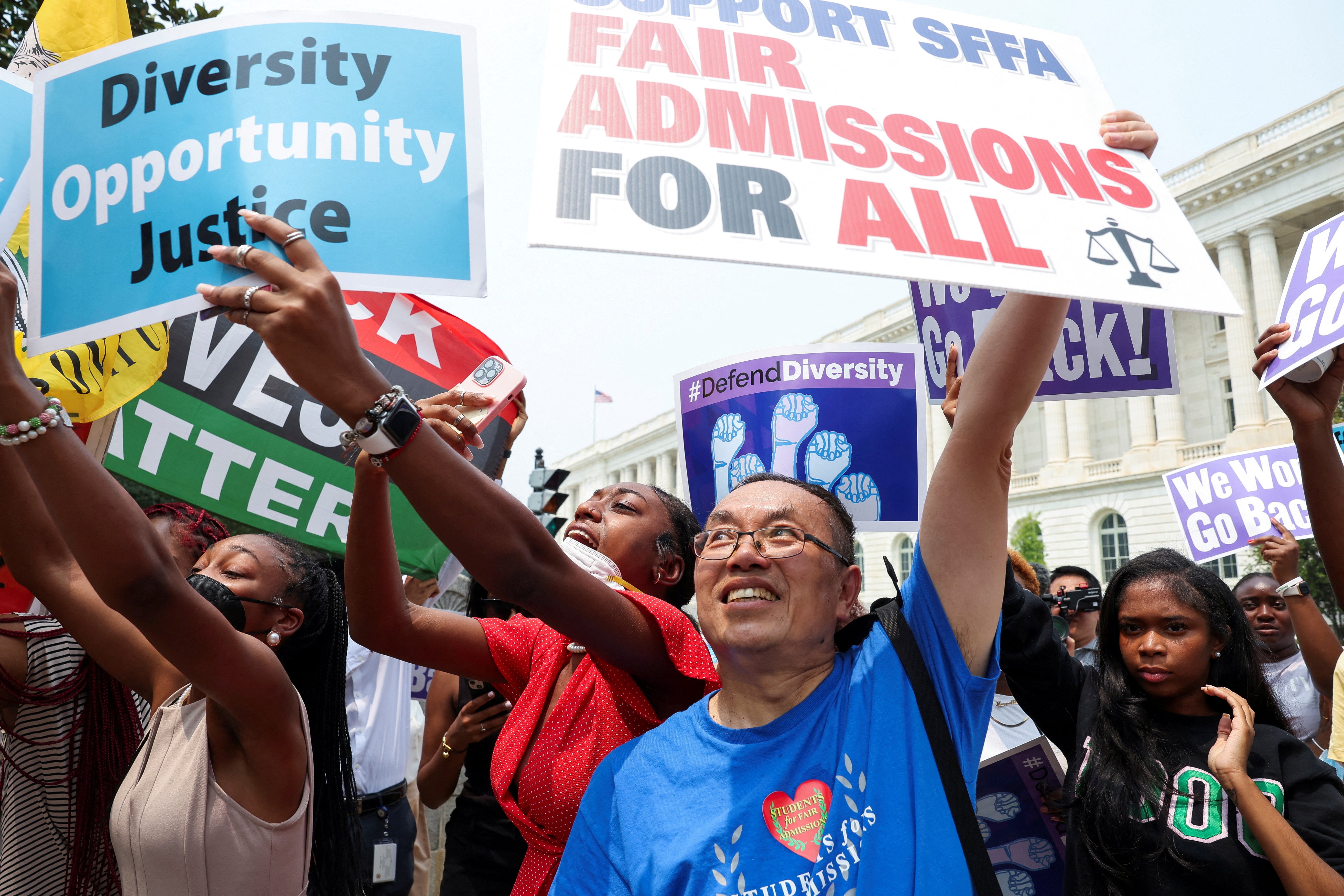 Demonstrators for and against the U.S. Supreme Court decision to strike down race-conscious student admissions programs at Harvard University and the University of North Carolina confront each other, in Washington, US, June 29, 2023