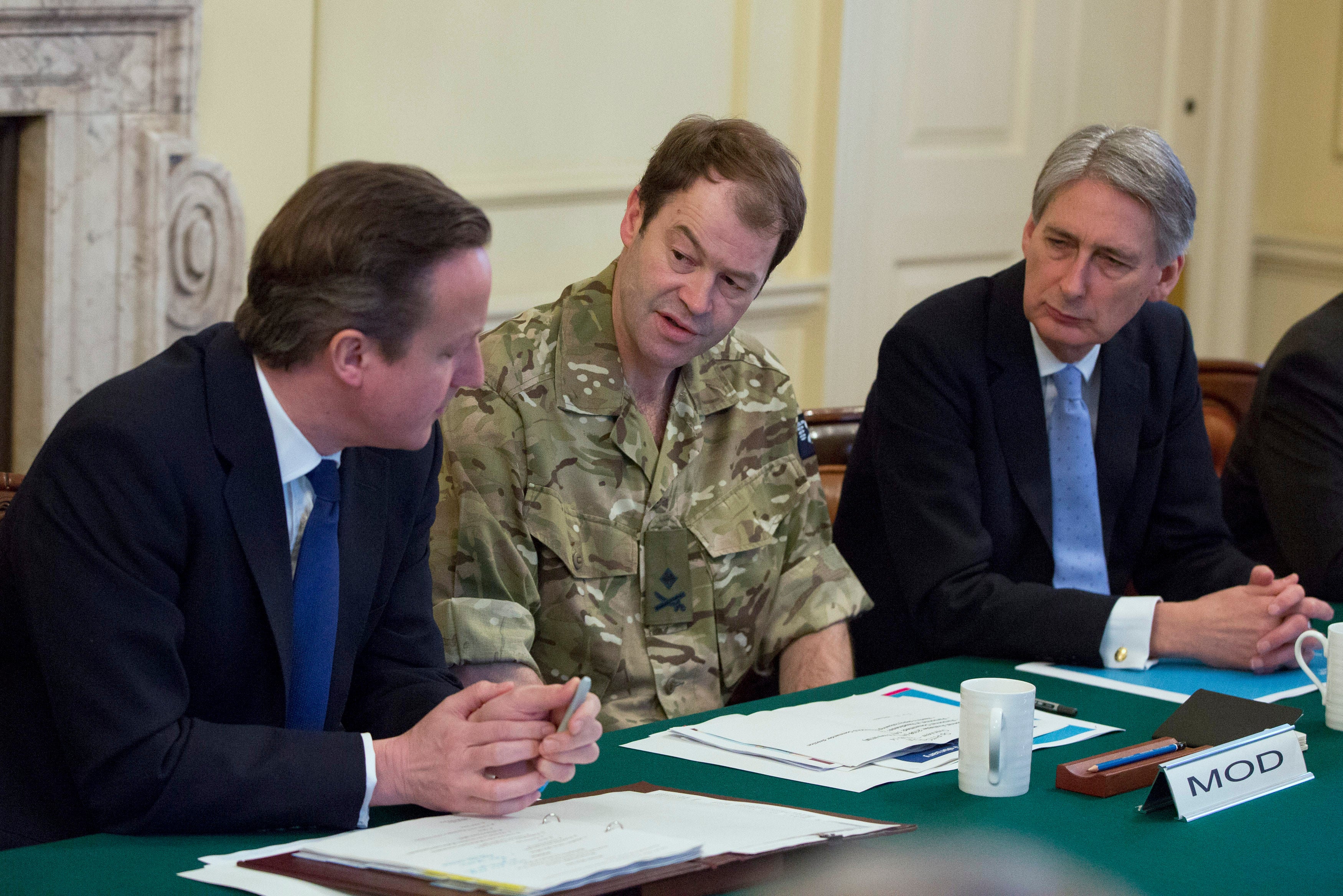 Last year General Sanders, pictured here with David Cameron, described cuts to the army under Boris Johnson’s government as ‘perverse’