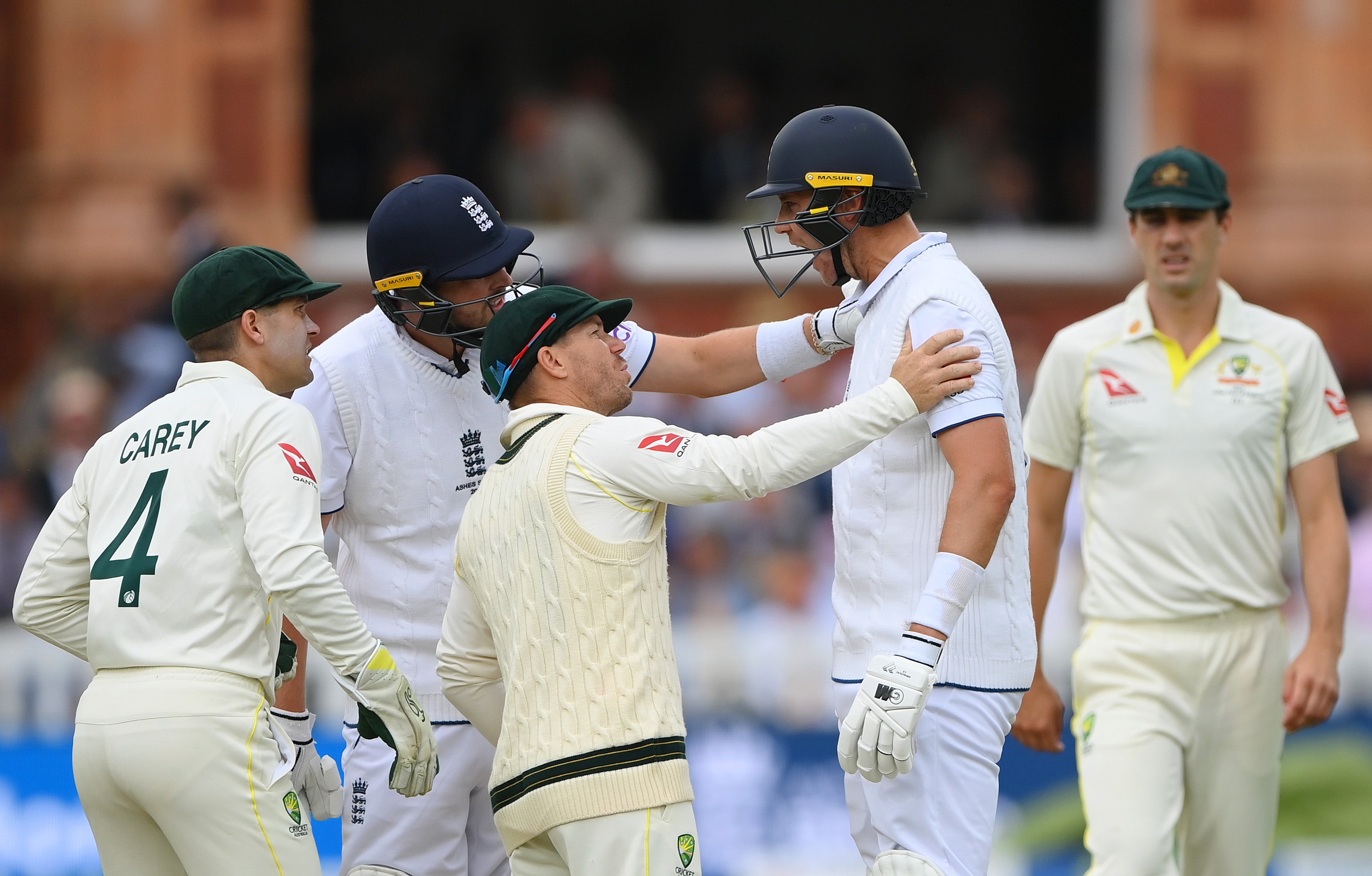 England and Australia players check on Stuart Broad after the ball strikes his jaw