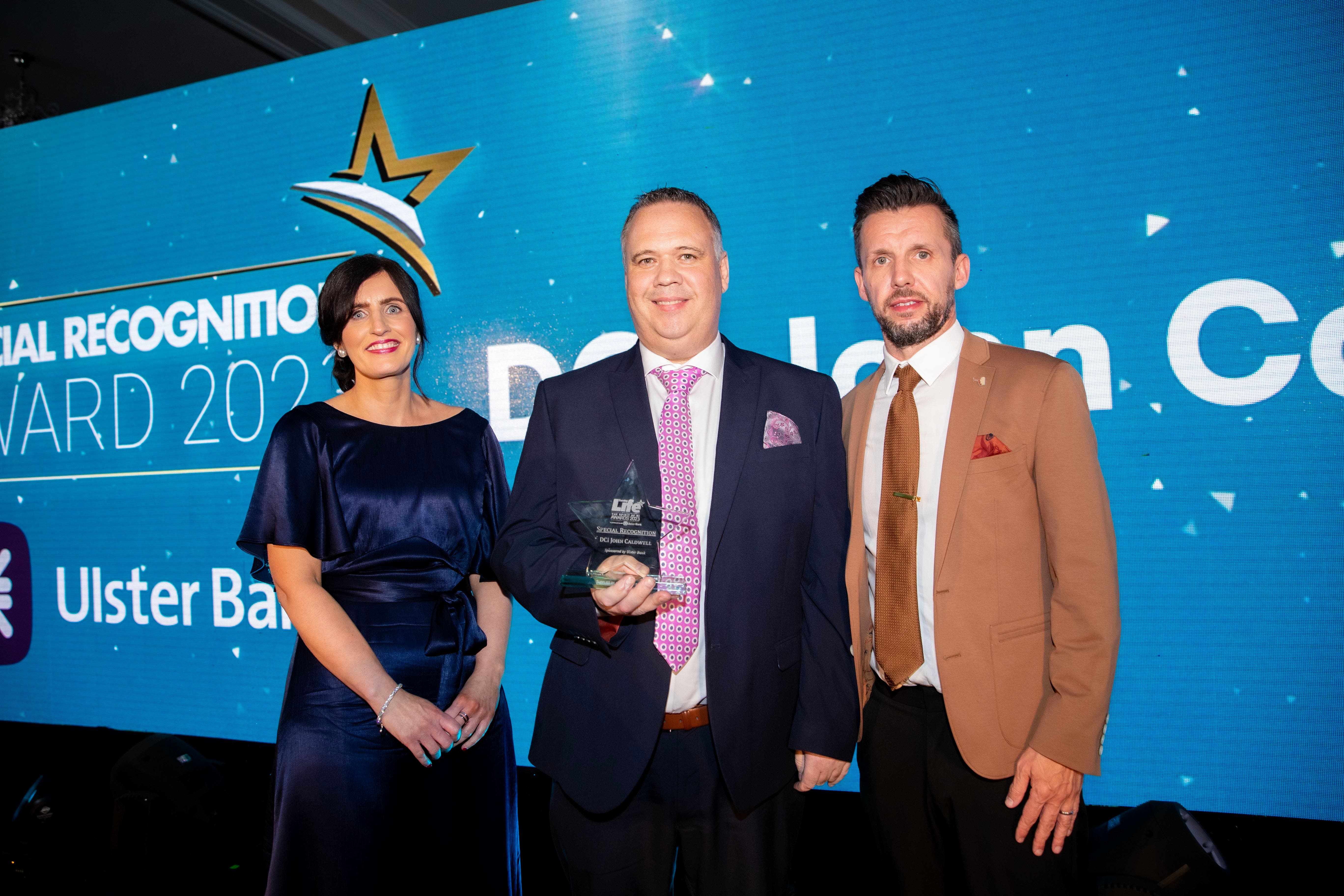 DCI John Caldwell wins the Special Recognition Award presented by Terry Robb, head of personal banking at Ulster Bank, at the Sunday Life Spirit of Northern Ireland awards (Kevin Scott for Sunday Life/ PA)