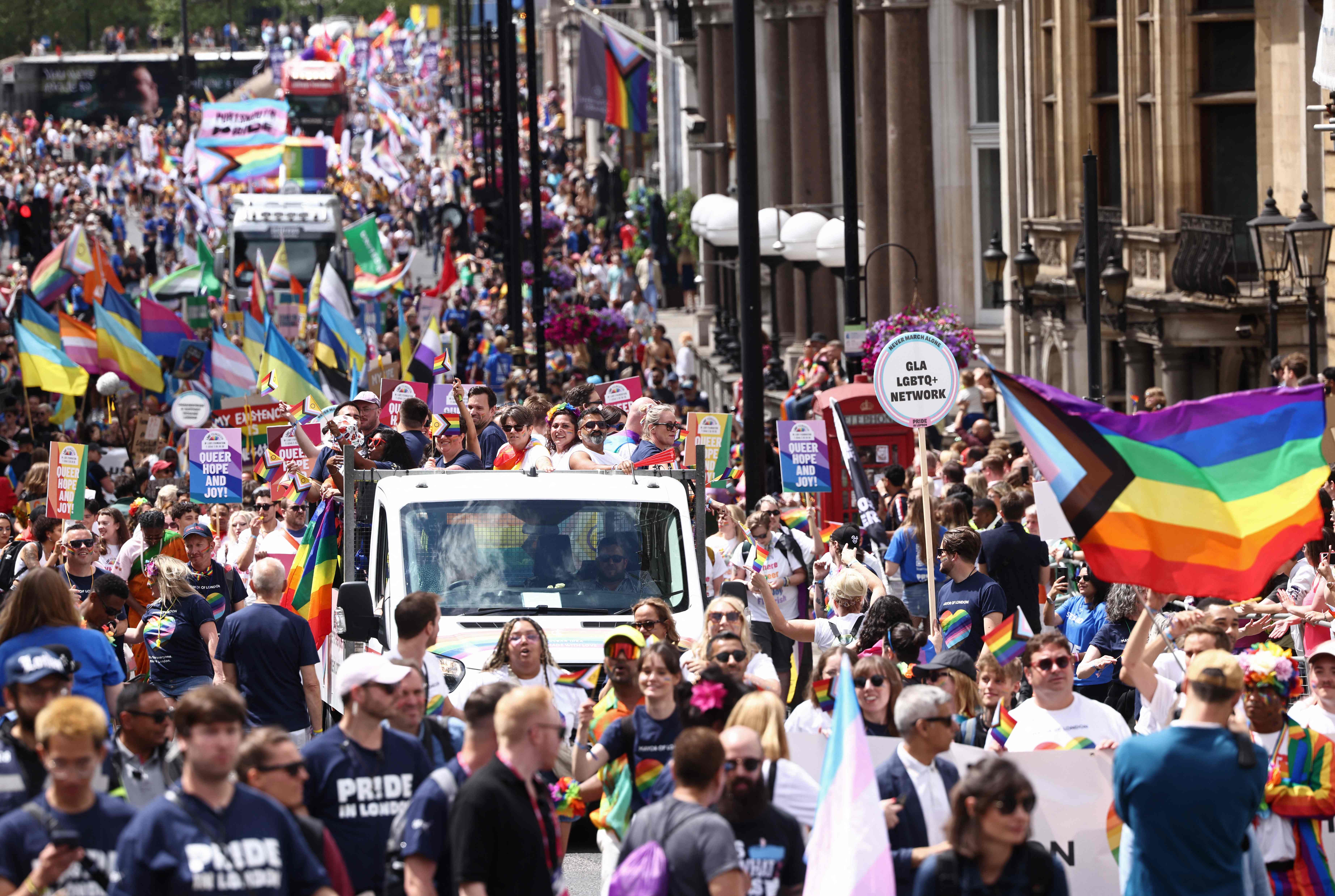 Members of the LGBT+ community take part in the annual Pride Parade in the streets of London