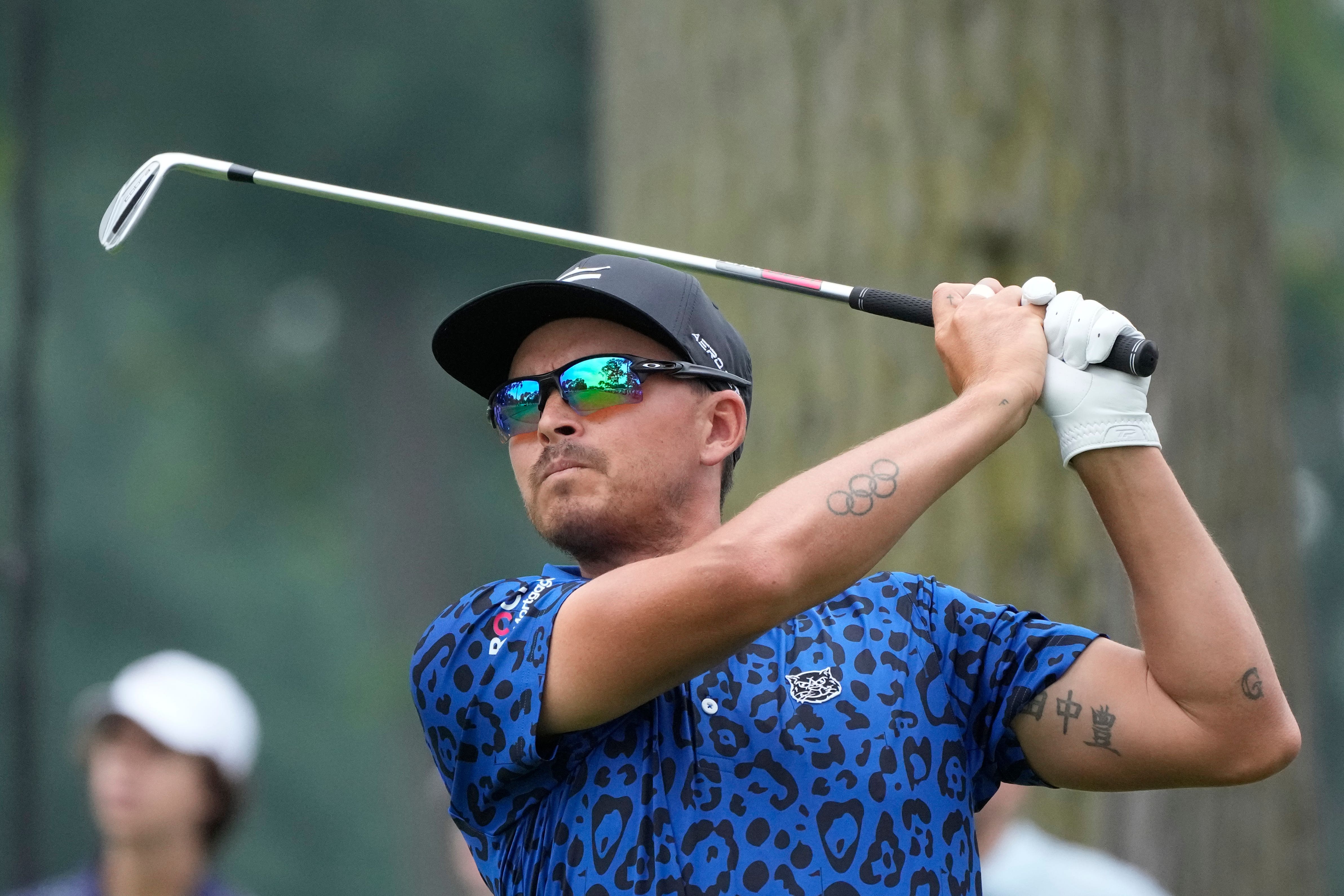 Rickie Fowler drives off the fifth tee during the third round of the Rocket Mortgage Classic (Carlos Osorio/AP)