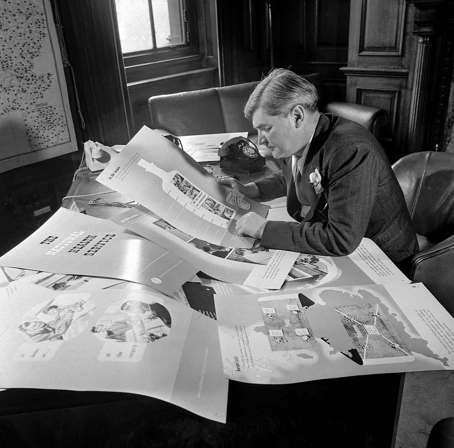 Aneurin Bevan, Labour Minister for Health, reviews the public information campaign in July 1948