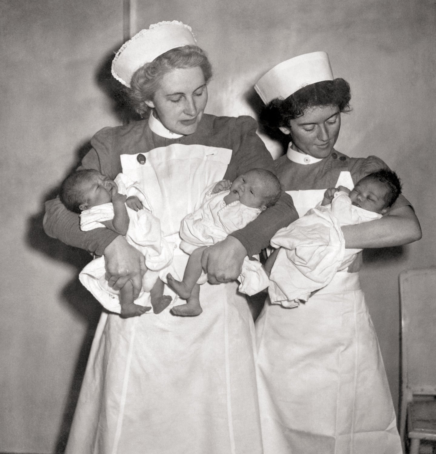 Nurses cradle the first babies to be born under the new National Health Service on 5 July 1948