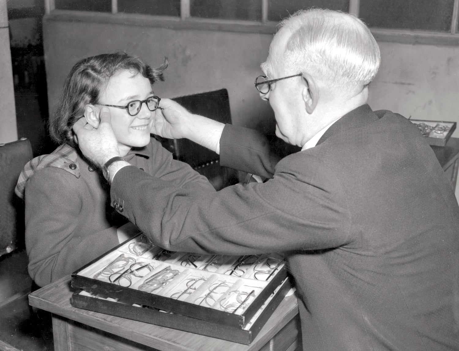 Patient being fitted for glasses at the Moorfields Eye Hospital in east London, 1950