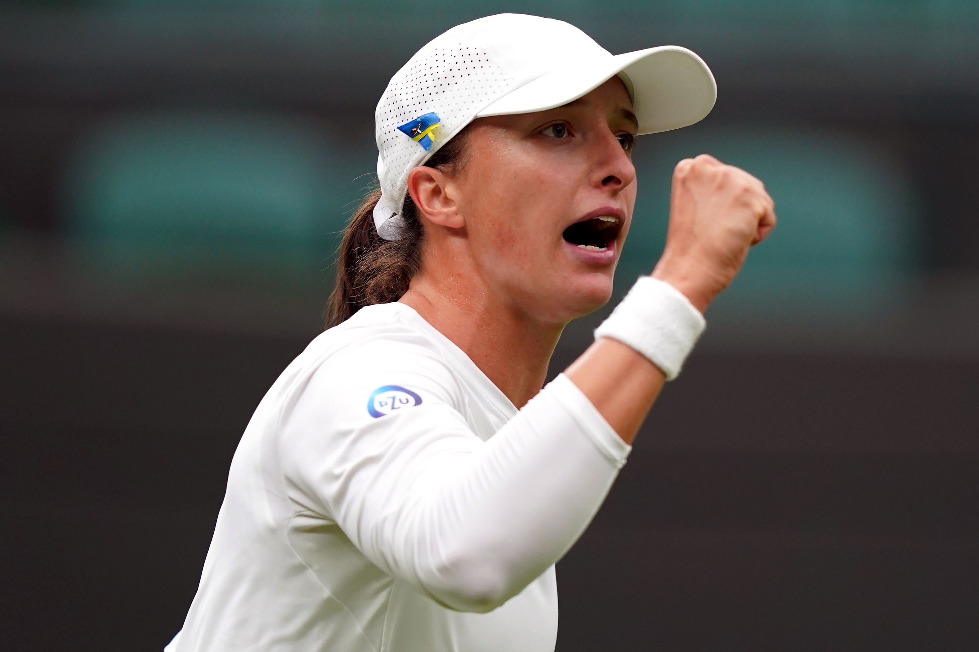 Iga Swiatek celebrates her first-round victory (John Walton/PA)