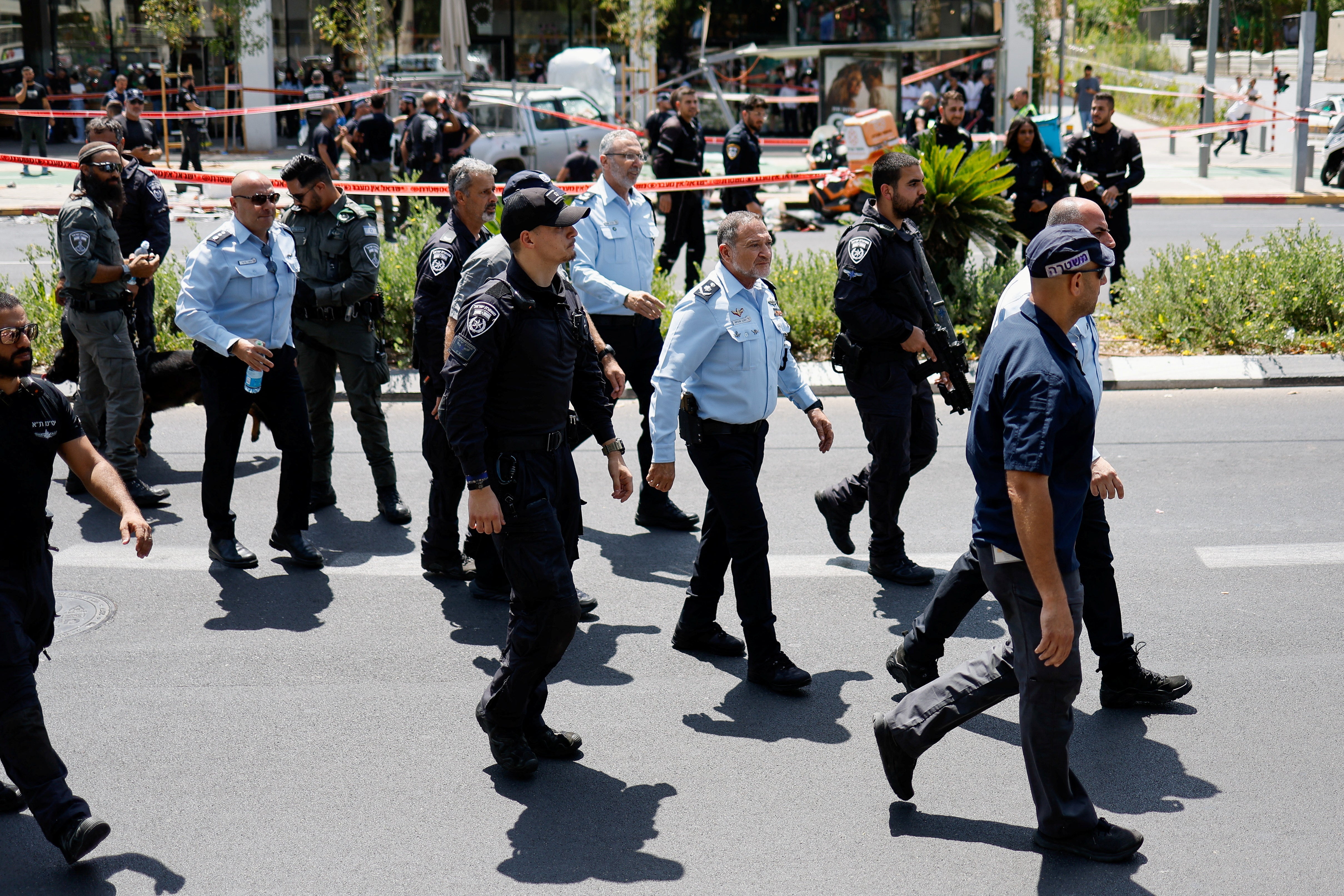 Israeli police walk at the scene of a ramming attack in Tel Aviv,