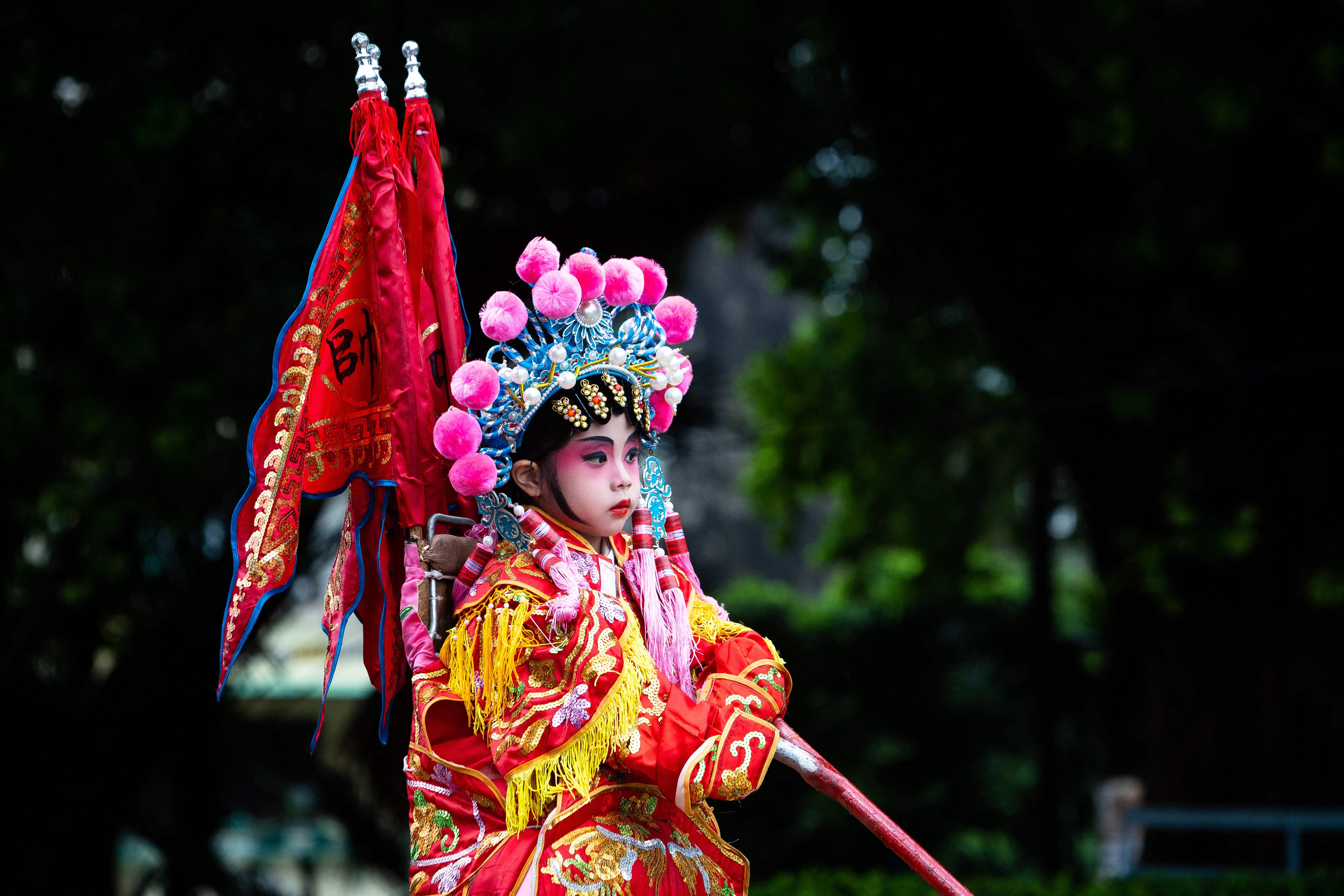 A child dressed as deity waits for the beginning of a parade marking the Feast of Na Tcha in Macau