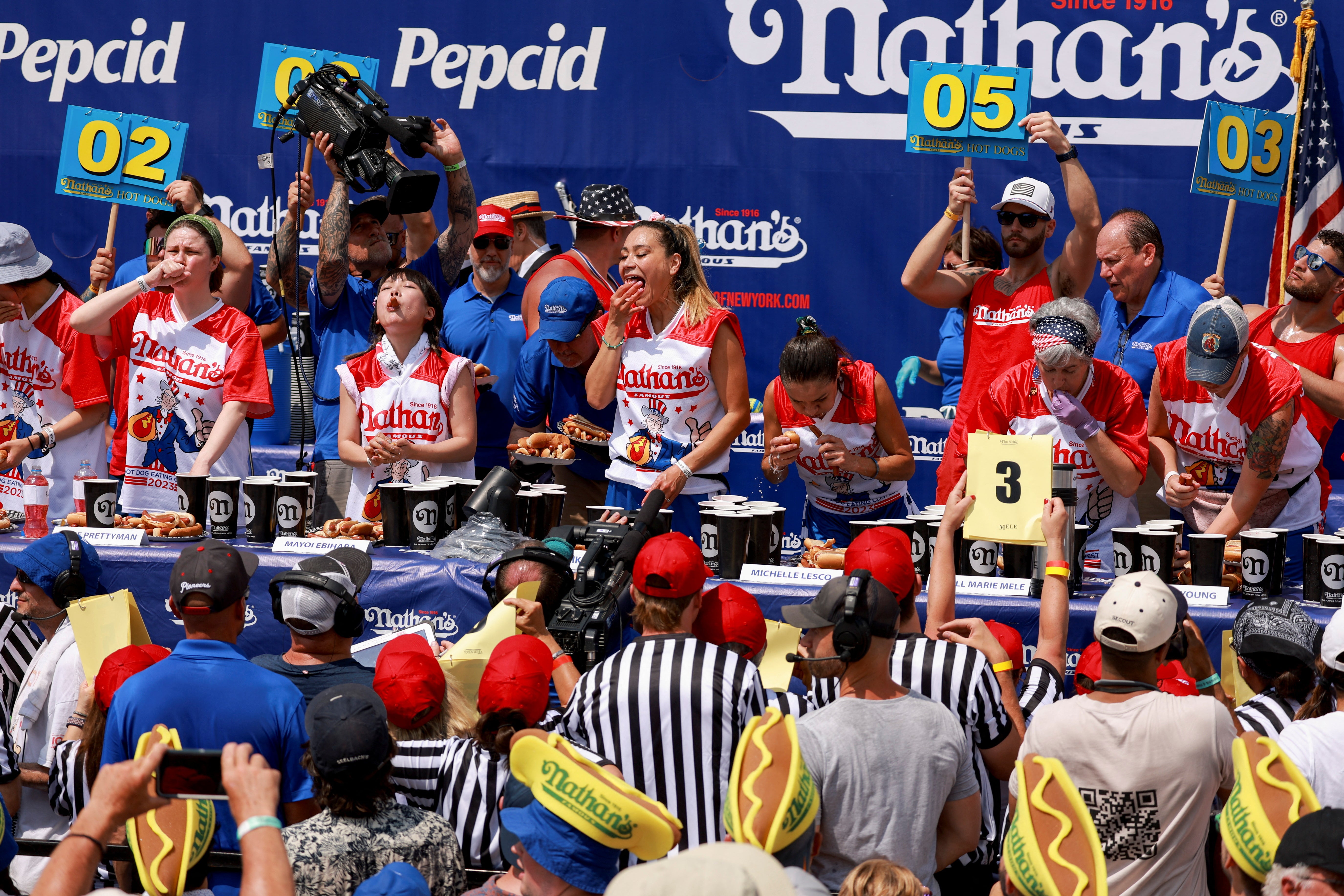 People compete in Nathan’s Famous Fourth of July International Hot Dog Eating Contest at Coney Island in New York City, US