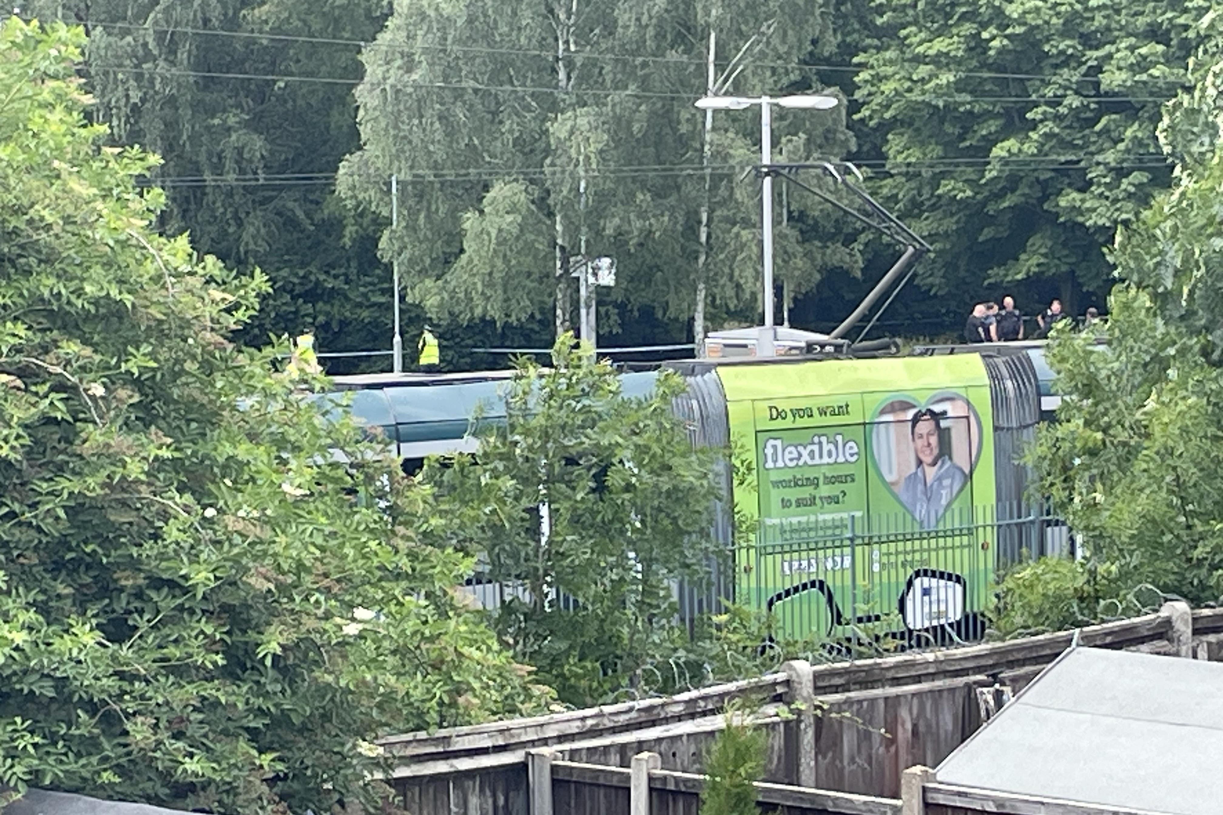 A tram at the scene of the murder (Callum Parke/PA)