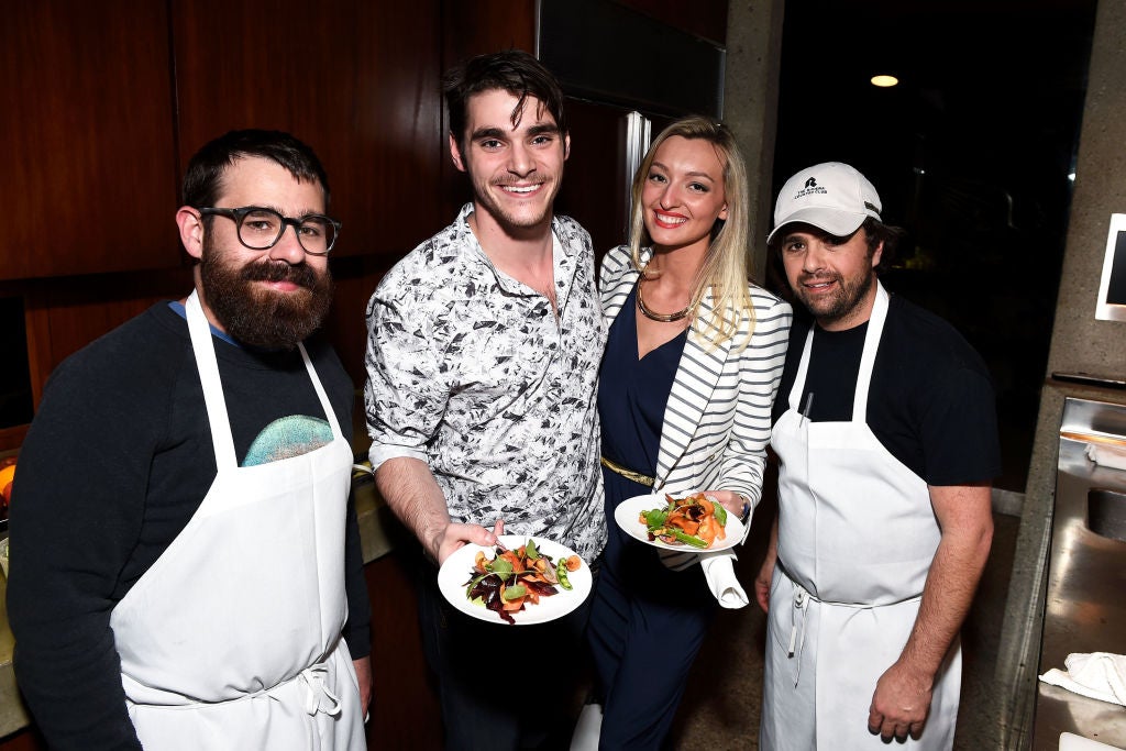 RJ Mitte and Joelle Posey get salads prepared by Chefs Vinny Dotolo (left) and Jon Shook of Jon & Vinny’s during E!’s The Arrangement Event on February 15, 2017 in Los Angeles, California