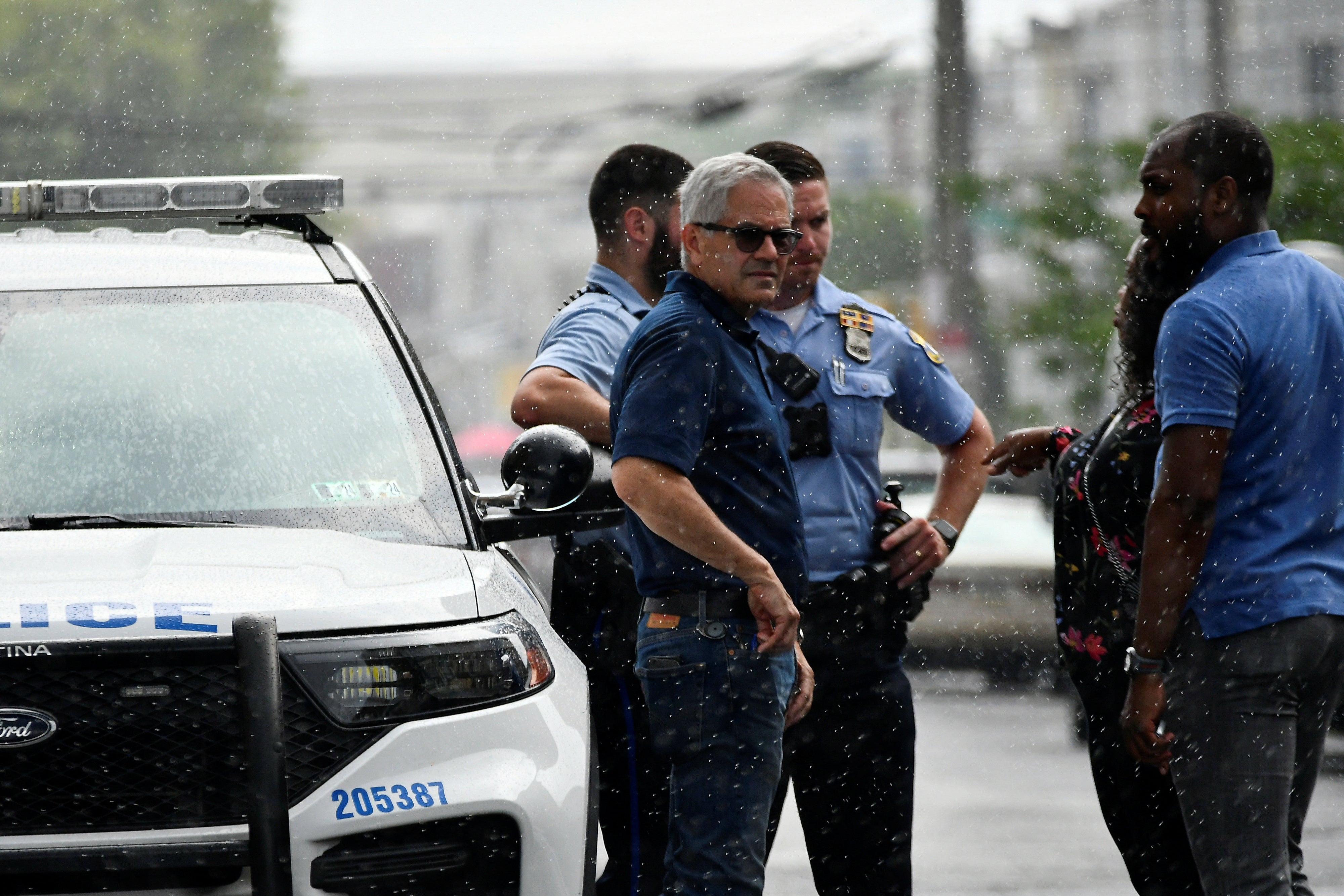 Police officers work at the scene the day after a shooting in the Kingsessing section of southwest Philadelphia, Pennsylvania