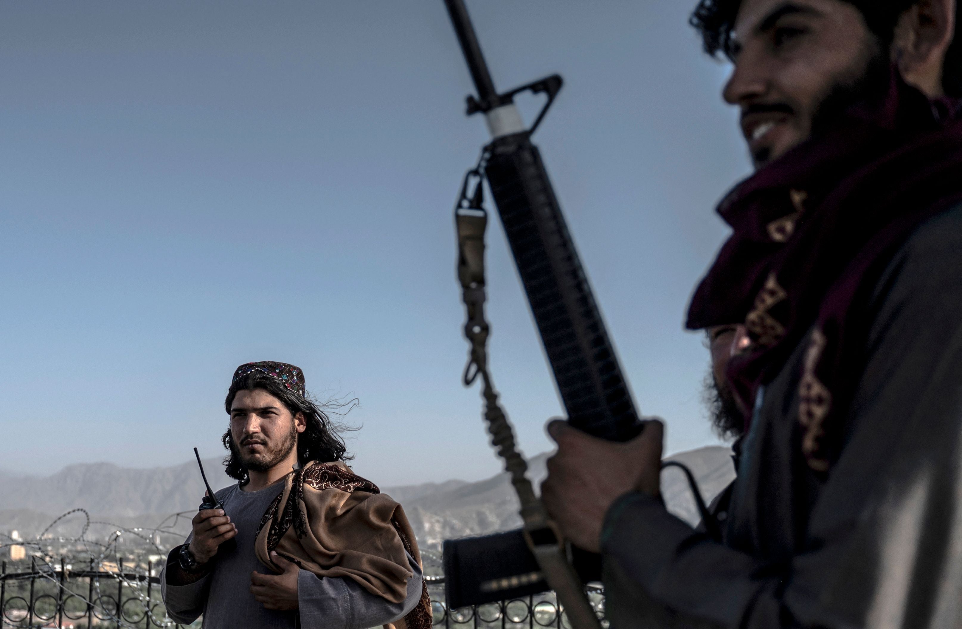 Taliban security personnel stand guard at the Wazir Akbar Khan hilltop overlooking Kabul city on 2 July