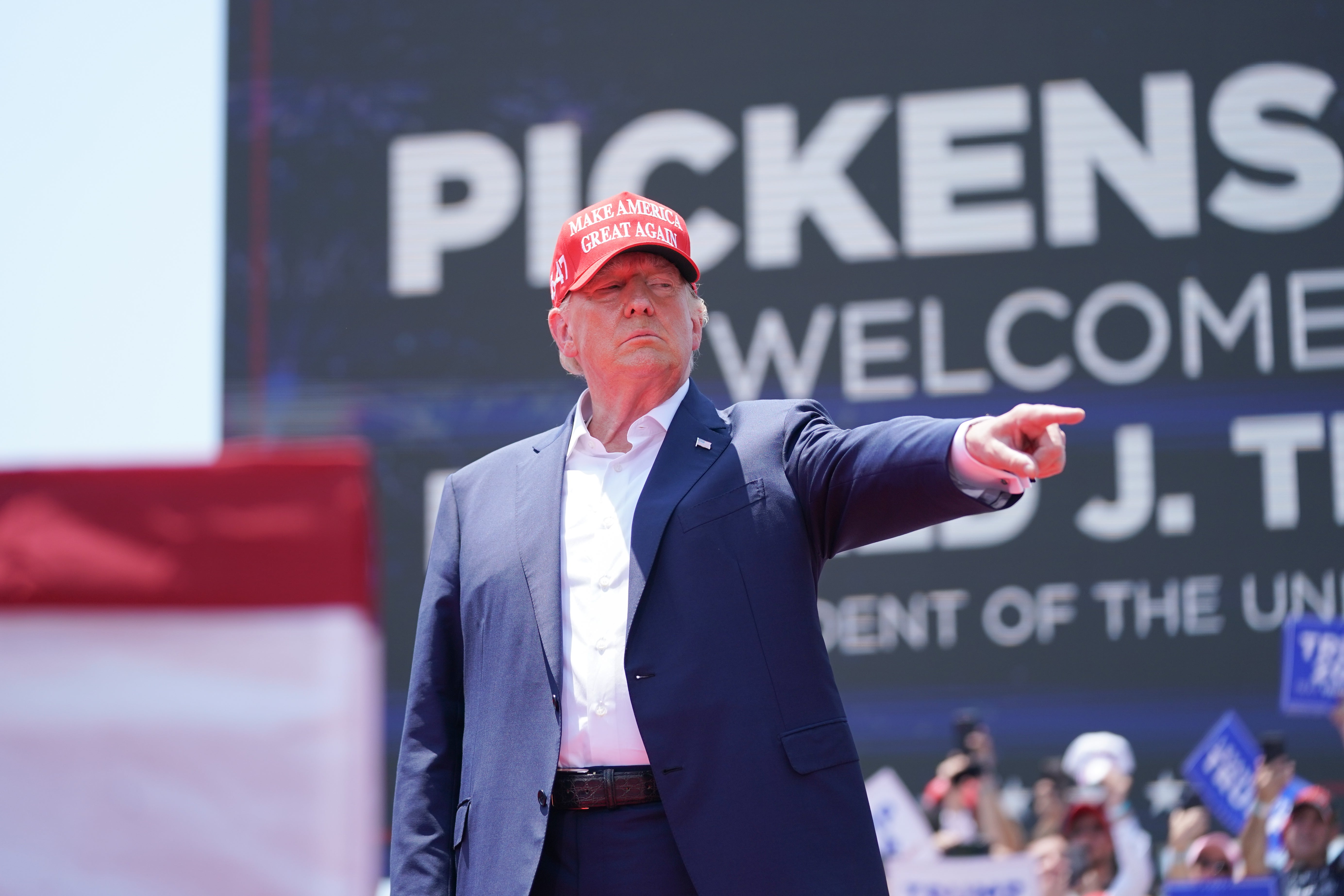 Former US President Donald Trump gestures to the crowd at a campaign event on July 1, 2023 in Pickens, South Carolina.