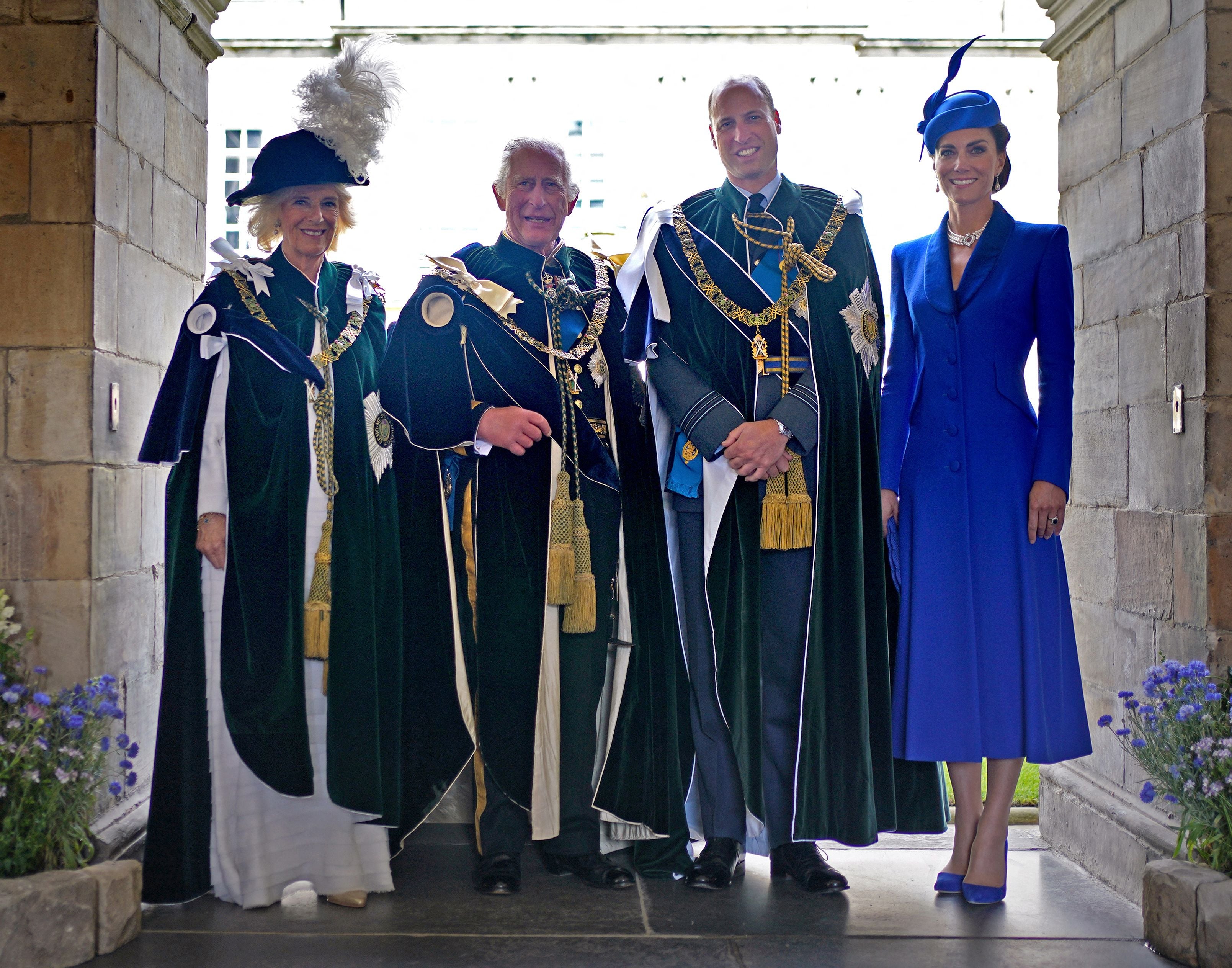 Queen Camilla, King Charles III, Prince William, Prince of Wales and Catherine, Princess of Wales pose for a photograph after watching a flypast